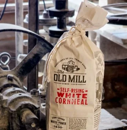 Closeup of The Old Mill's self-rising white corn meal in a cloth sack