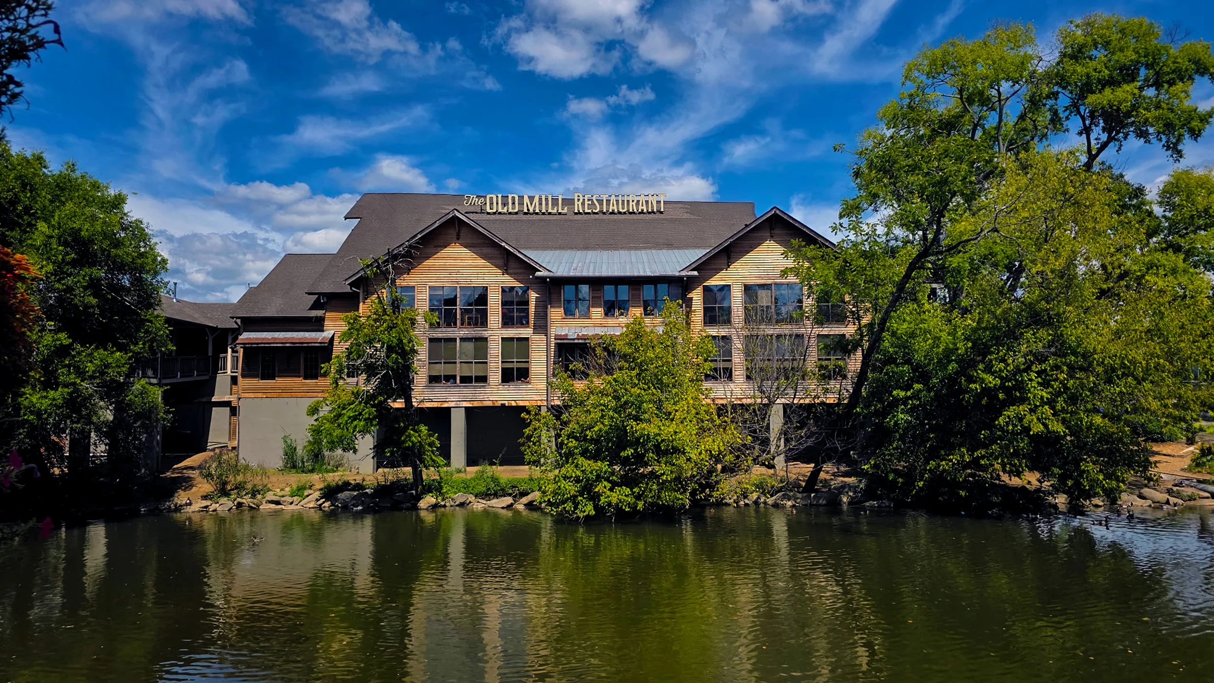 The Old Mill Restaurant along the Little Pigeon River in the summer