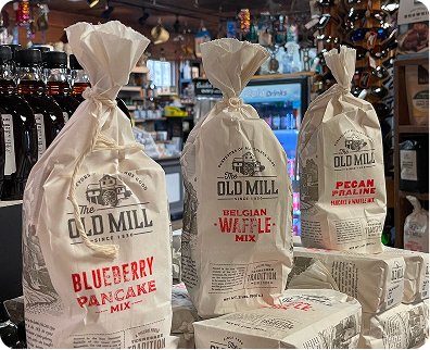 Photo of Blueberry and Pecan Praline pancake mix and waffle mix in cloth bags