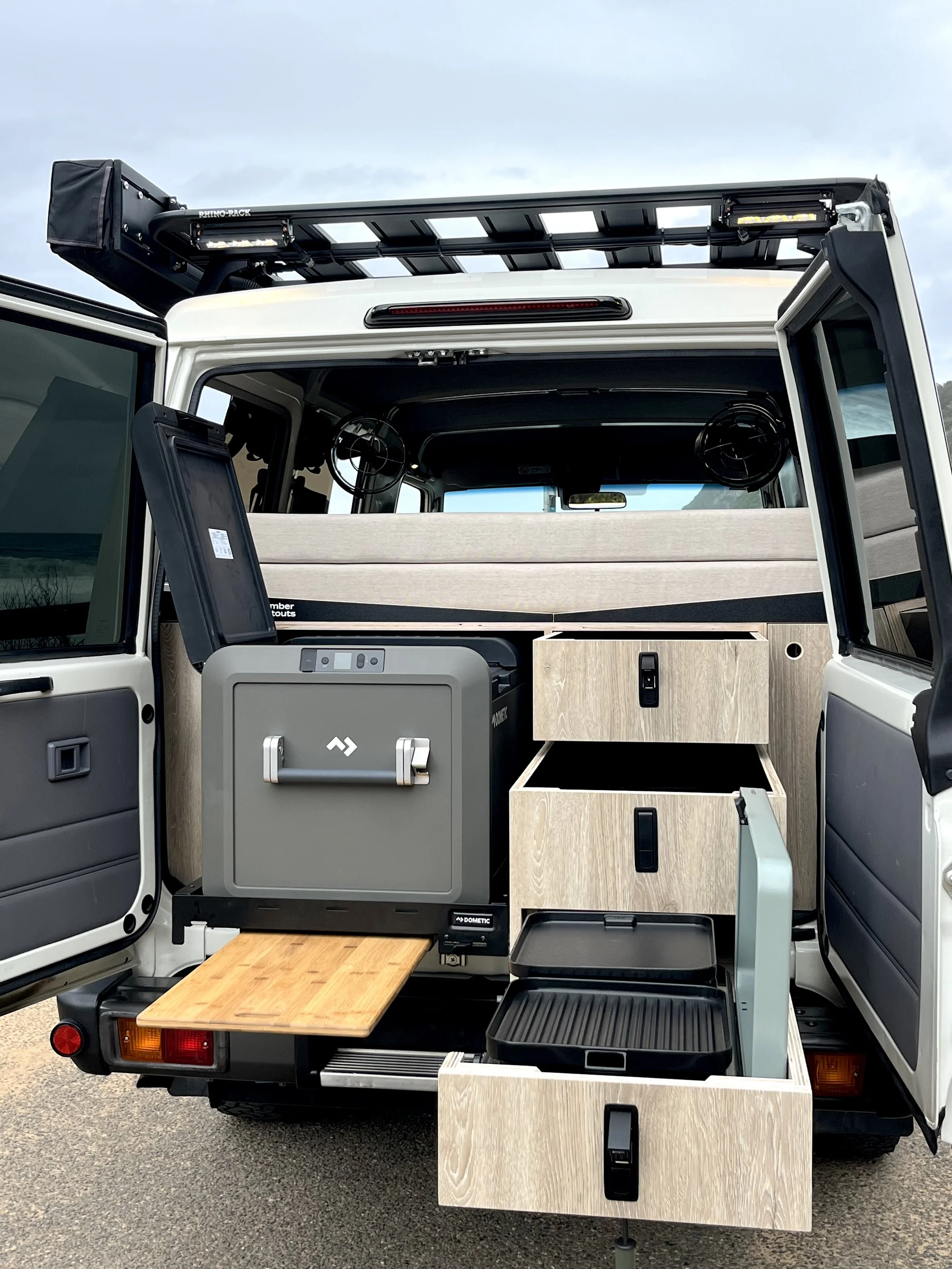 Toyota Troopy camper conversion showing rear storage, fridge system and off-road setup by Amber Fitouts.