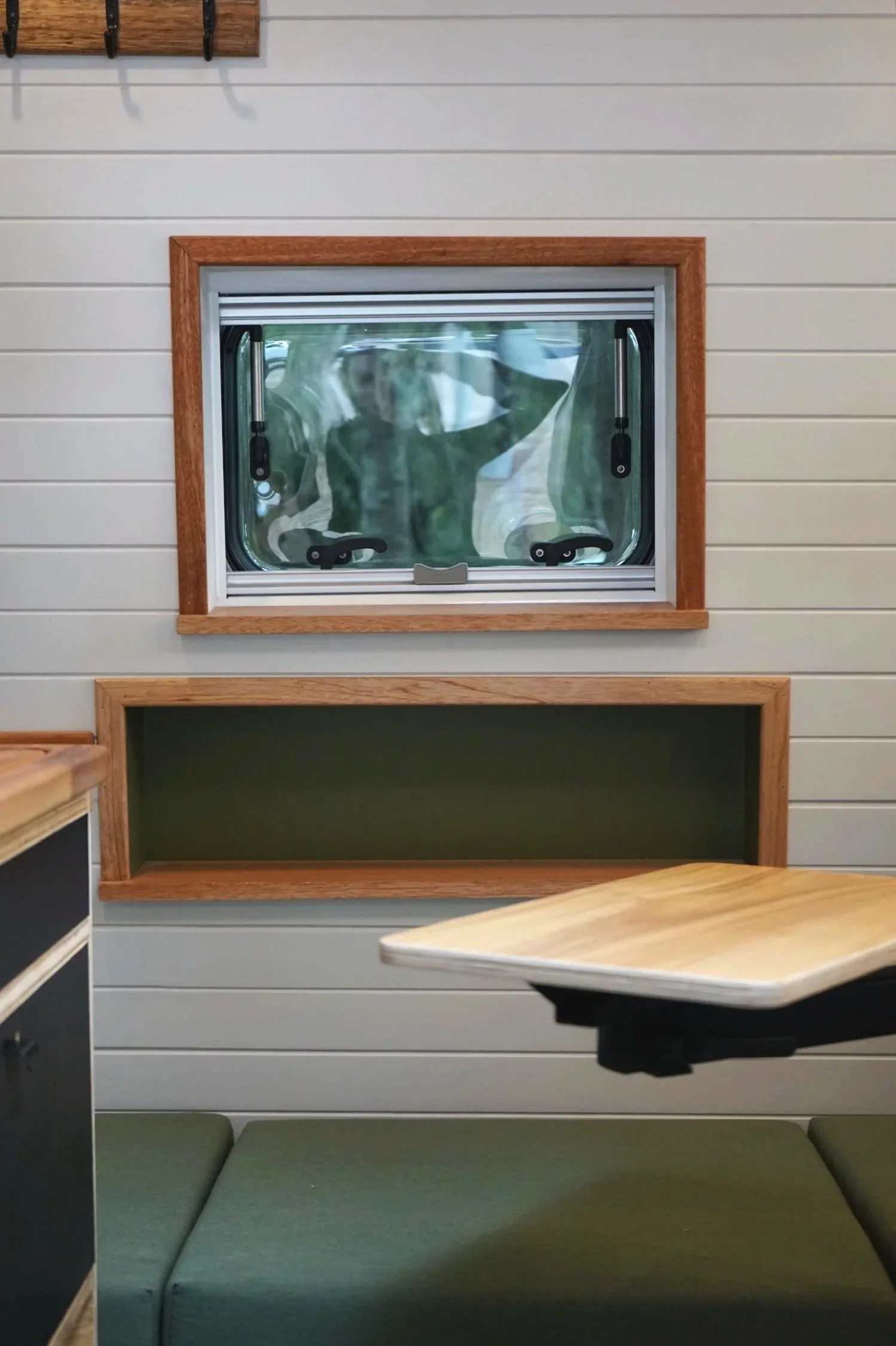 Ford Transit campervan kitchen with timber benchtop, sink, custom cabinetry and storage drawer