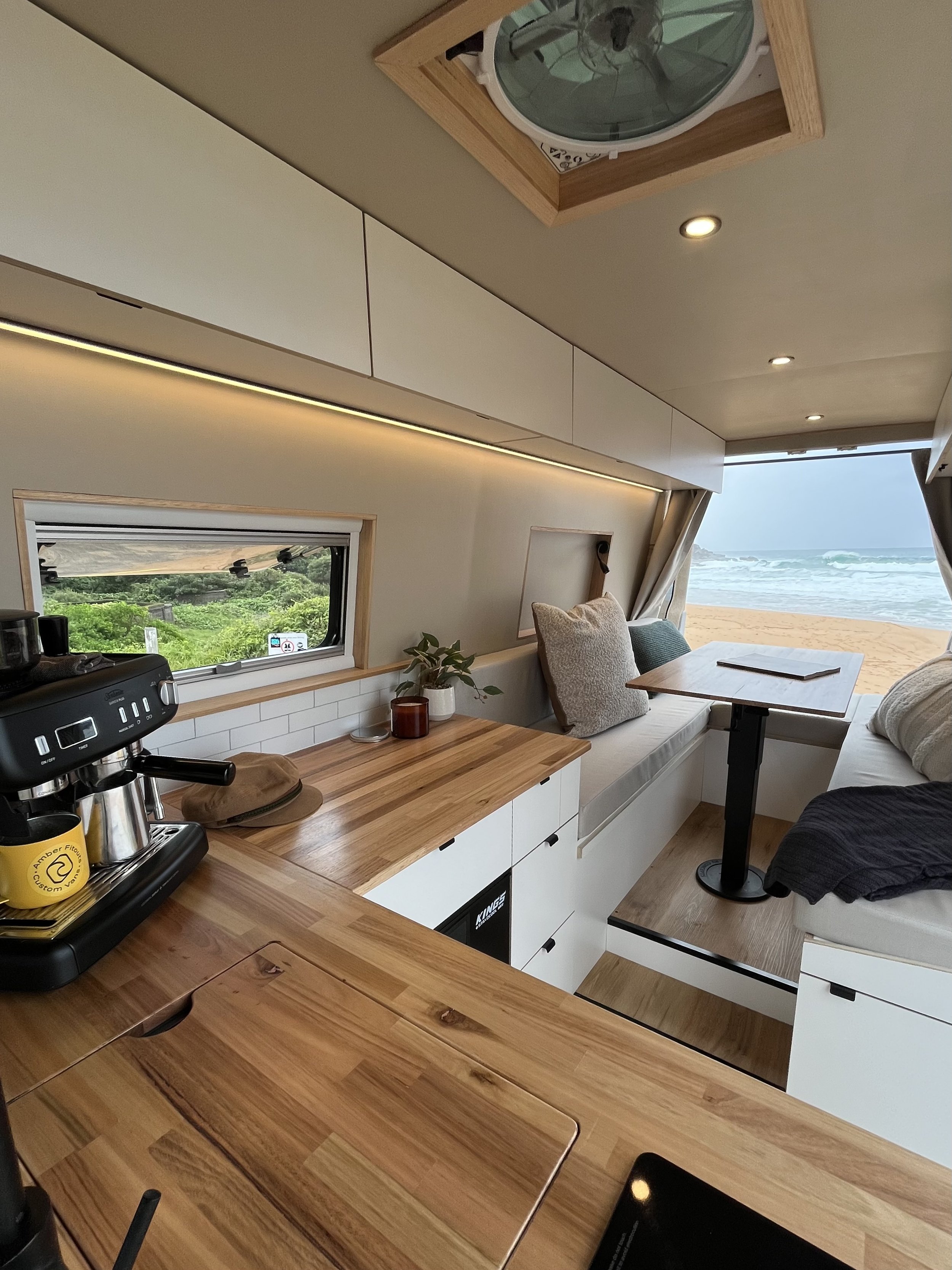 Mercedes Sprinter MWB High Roof campervan interior with kitchen, timber benchtop and living area