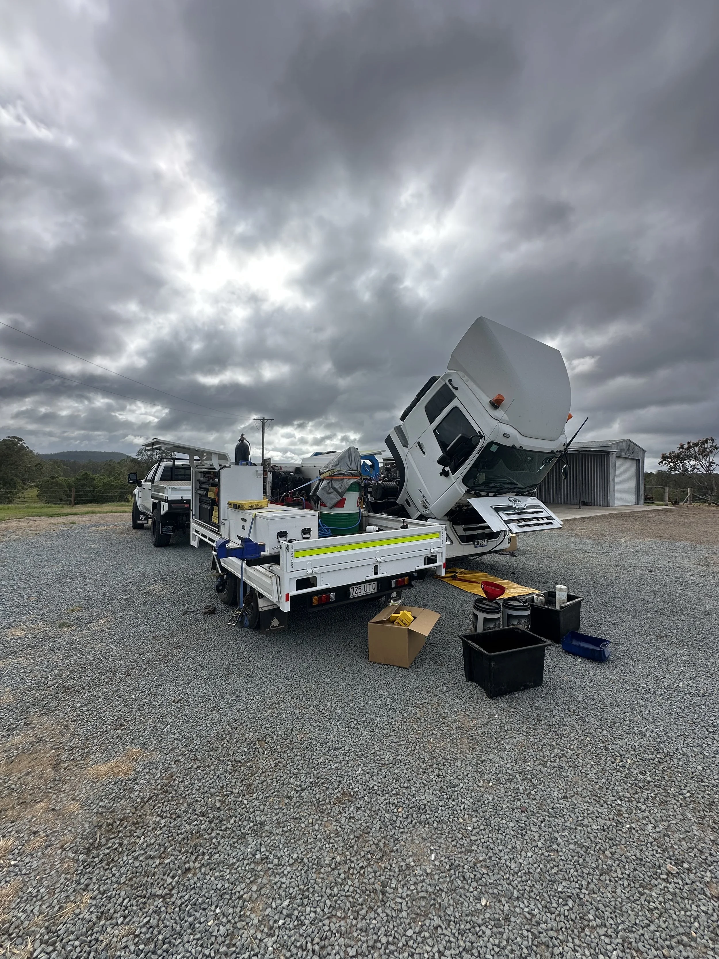 Mobile diesel fitter repairing earthmoving equipment in Hervey Bay