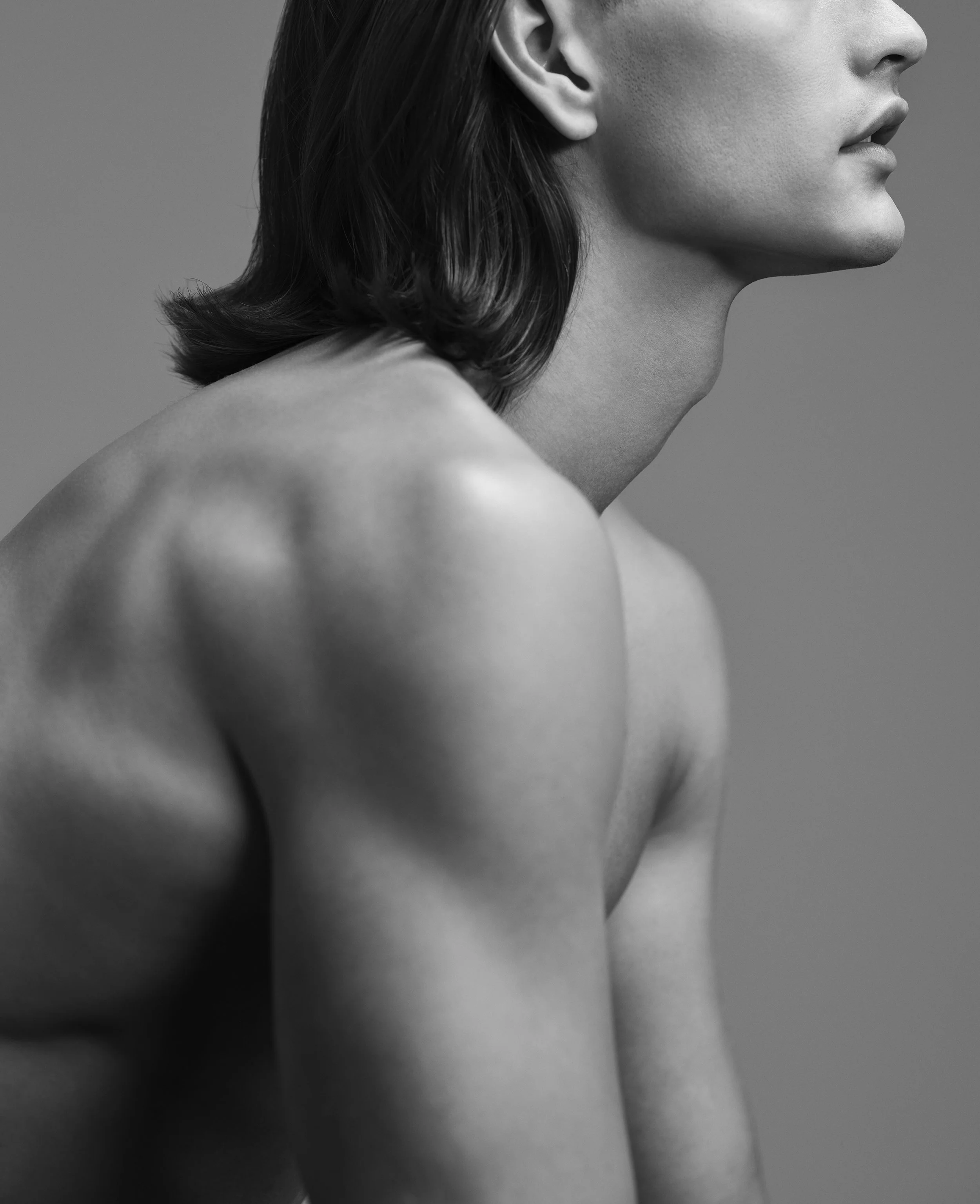 A black and white beauty side profile portrait of a male model