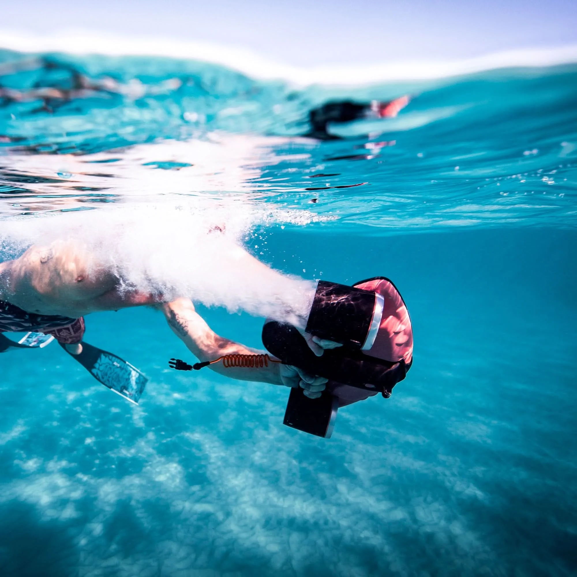 A person sea scootering by