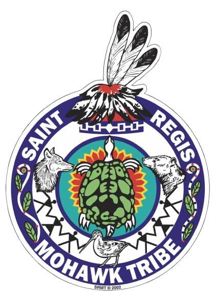 Emblem of the Saint Regis Mohawk Tribe featuring a central turtle, two wolves, a bird, and a feathered headdress above, with surrounding text and decorative elements.
