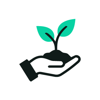 A hand holding a small plant with two green leaves.
