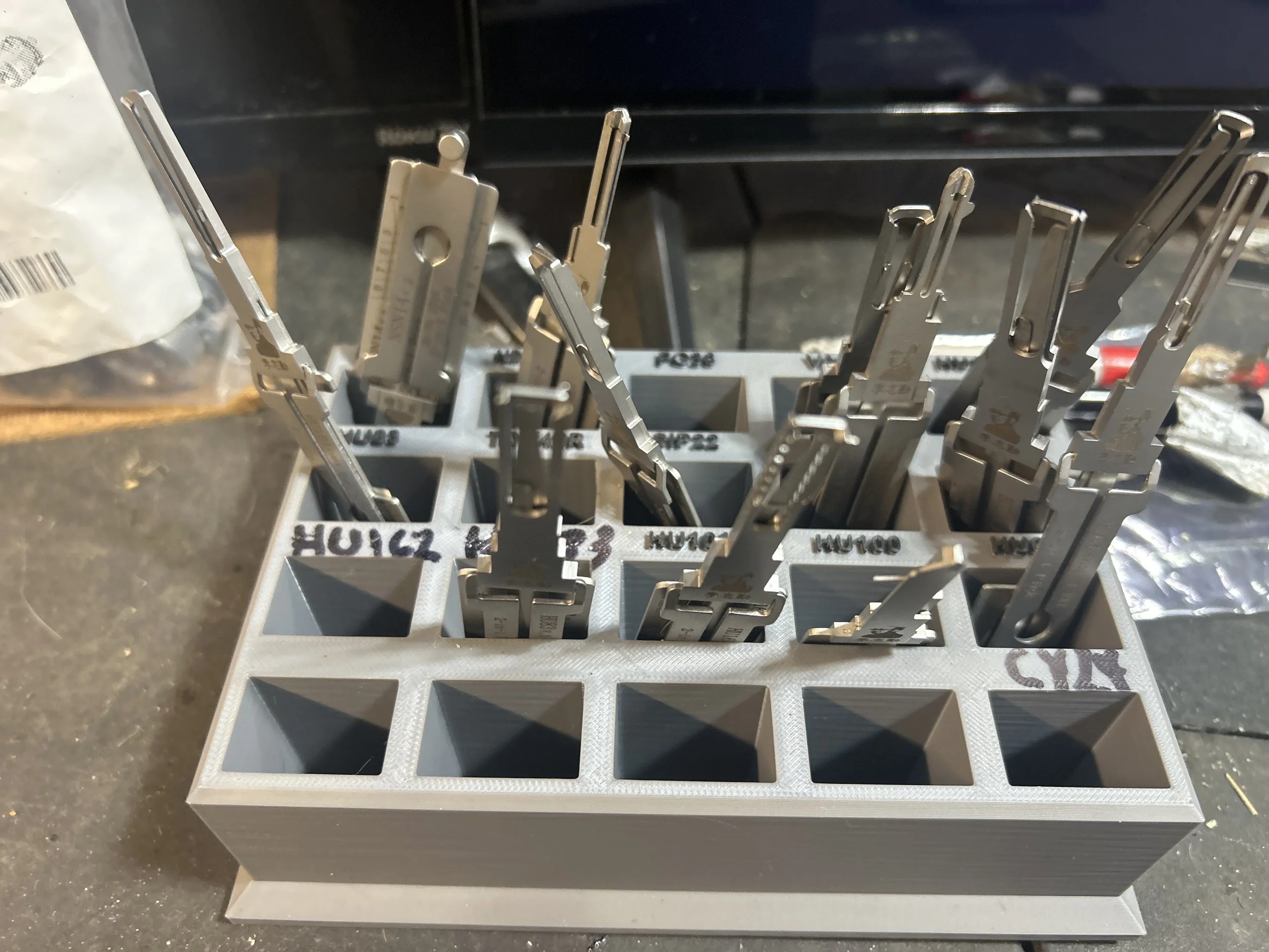 Lishi stand holding Lishi tools at a locksmith shop in Pensacola, Florida