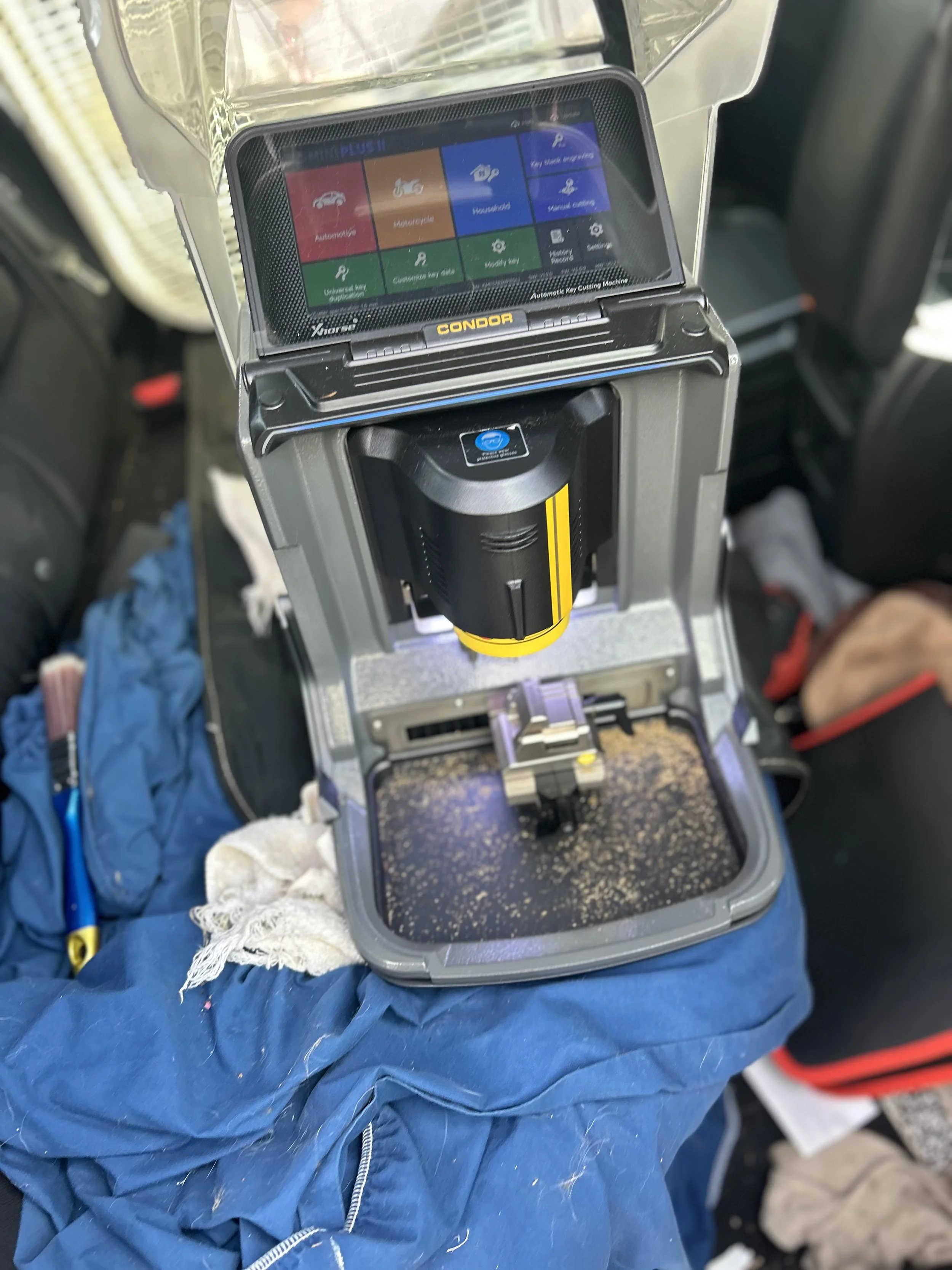 Xhorse key machine cutting a residential house key in Pensacola, Florida