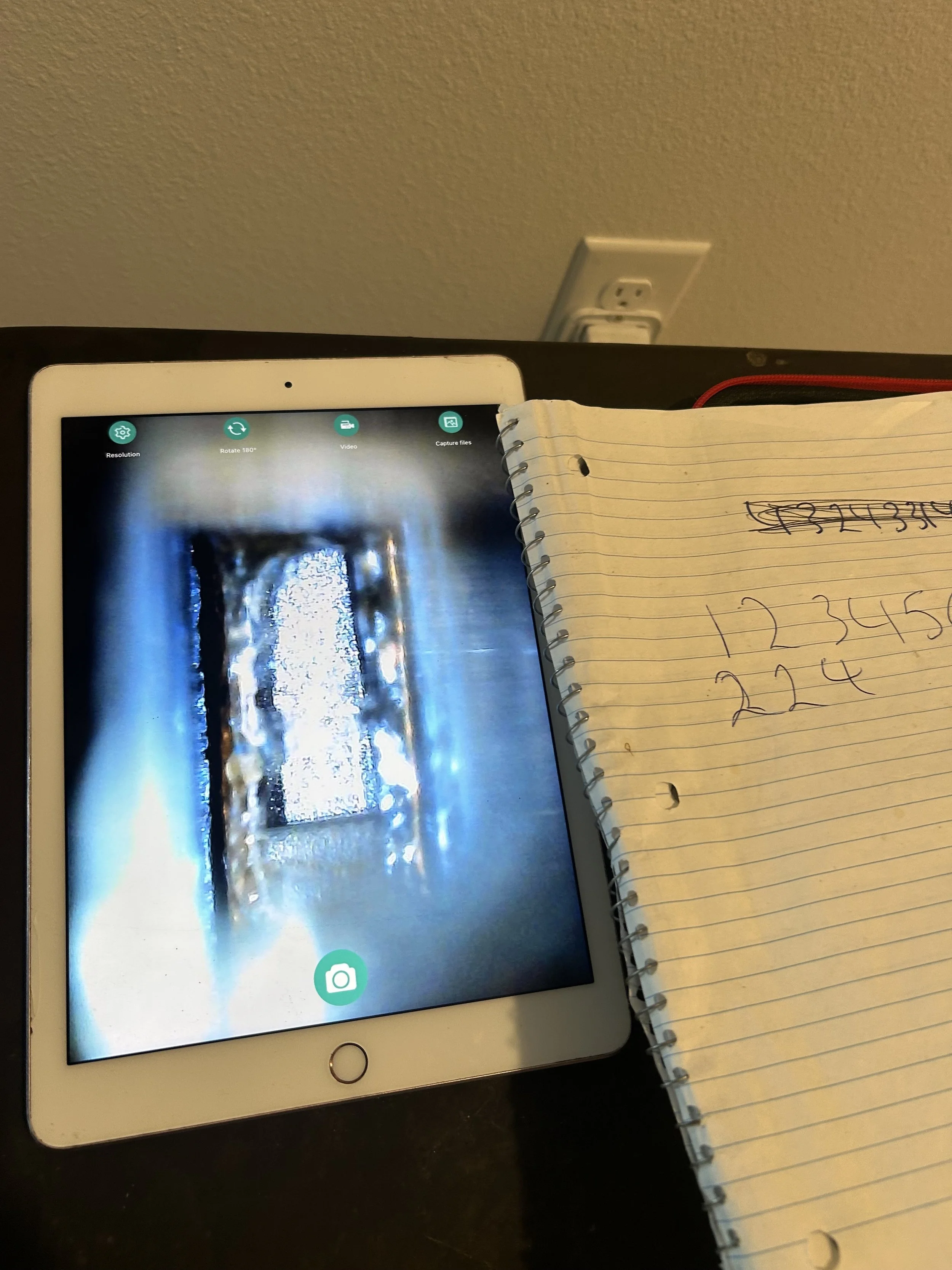 Mobile locksmith decoding a Kwikset SmartKey residential lock using professional optical decoding equipment in Pensacola, Florida.
