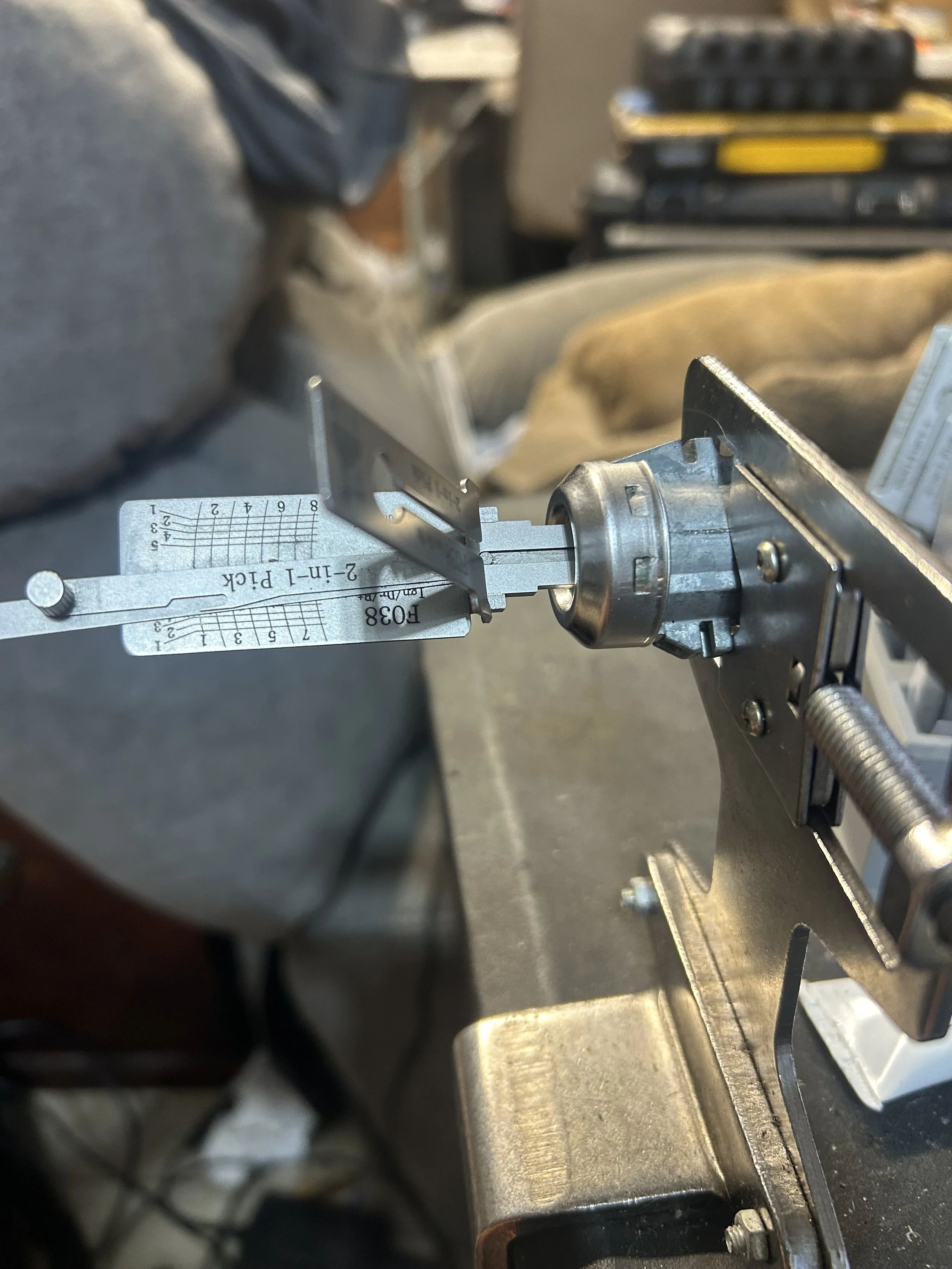 Ford FO38 lock in a vise with a Lishi tool, Pensacola locksmith shop