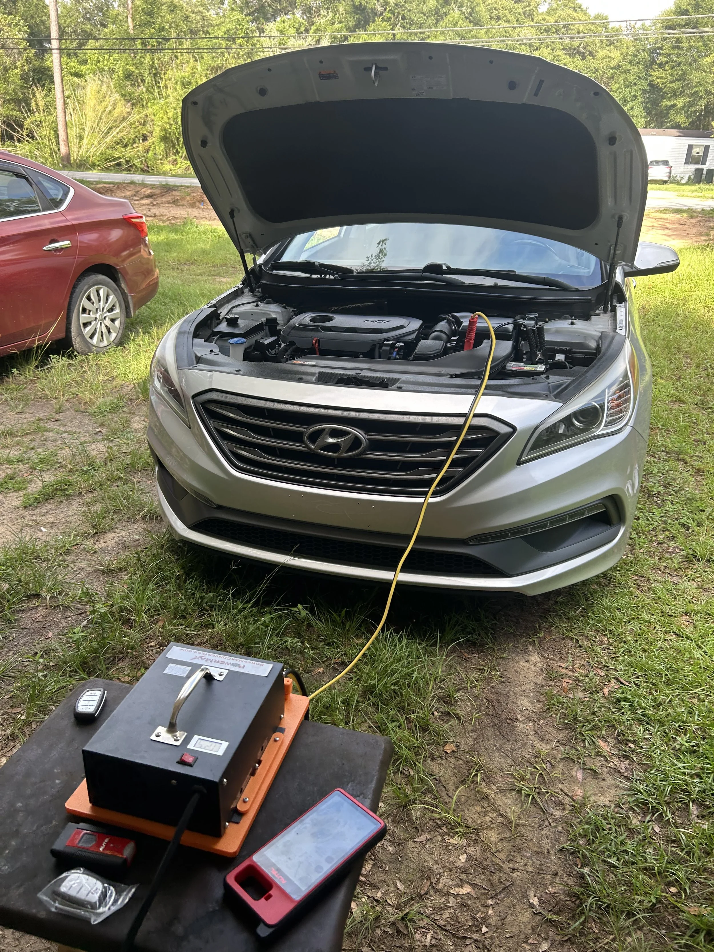 2017 Hyundai Sonata smart key programmed and emergency key cut by an auto locksmith in Pensacola, Florida.