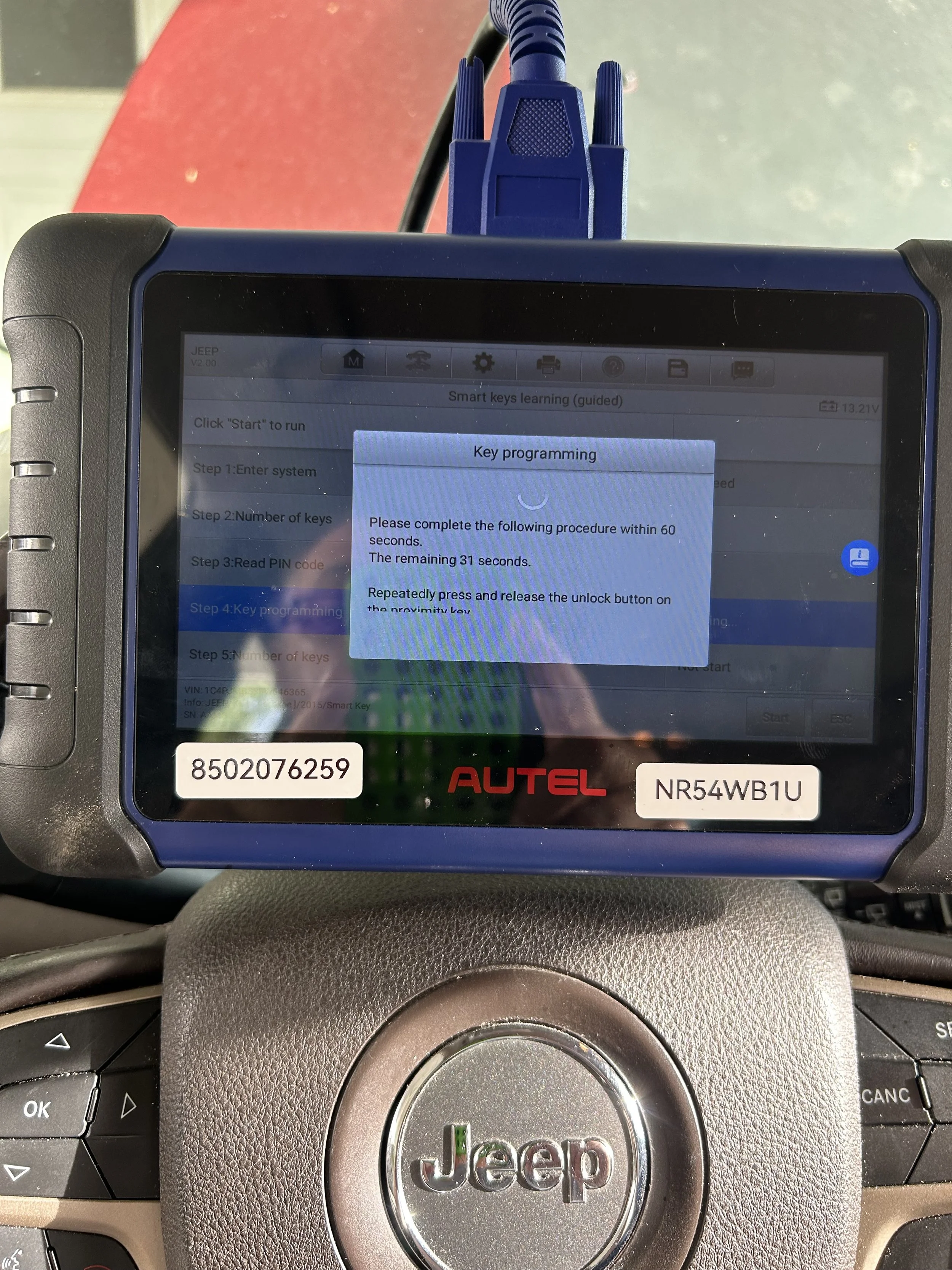 Reading a vehicle PIN code with a KM100 before key fob programming in Pensacola