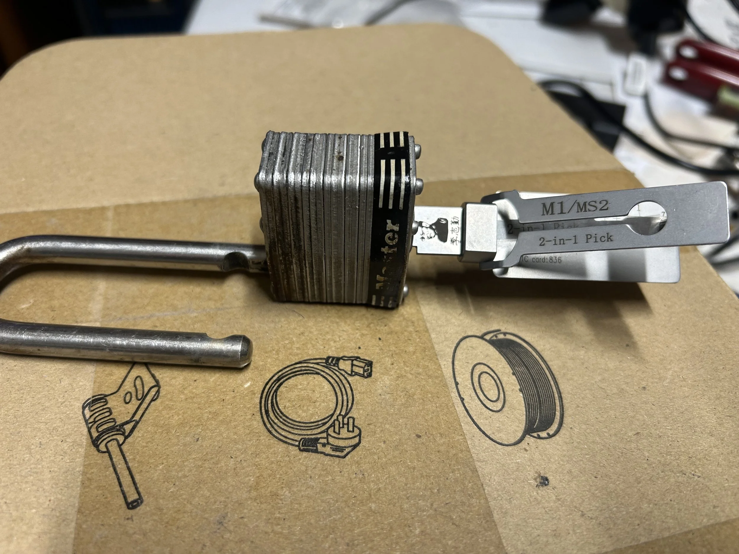 The M1/MS2 Lishi can pick and decode a compatible four-pin Master Lock cylinder. You can then cut a replacement key from the decoded depths