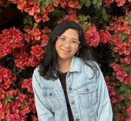 Screenshot of a social media post with text about storytelling and self-discovery, accompanied by three emojis: a heart with sparkles, a heart, and a yellow heart.