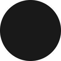 A solid black circle on a white background.