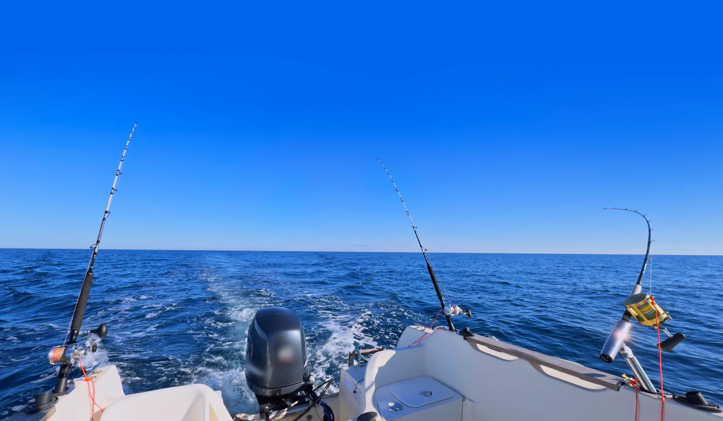 Trolling rods while cruising on the sea off Denia