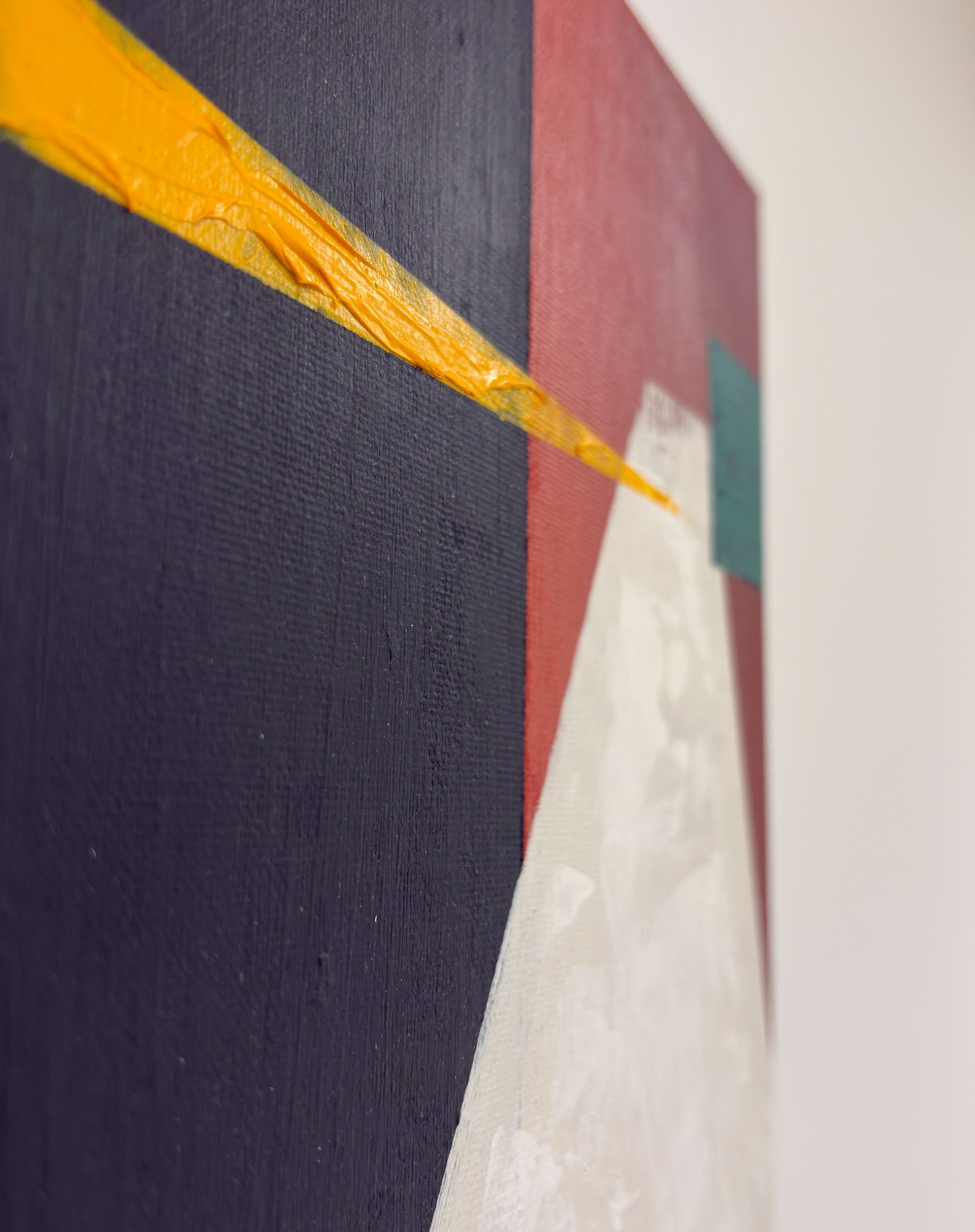 Angled close-up of a colorful geometric abstract lighthouse painting on a wall with textured canvas, featuring bold blocks of black, red, and mottled textured off whites, and a bold diagonal stripe depicting light.