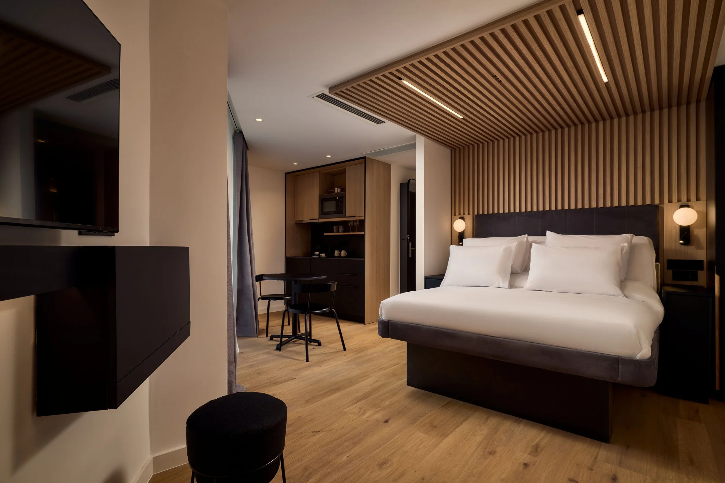 Double bed, table, chairs and kitchenette