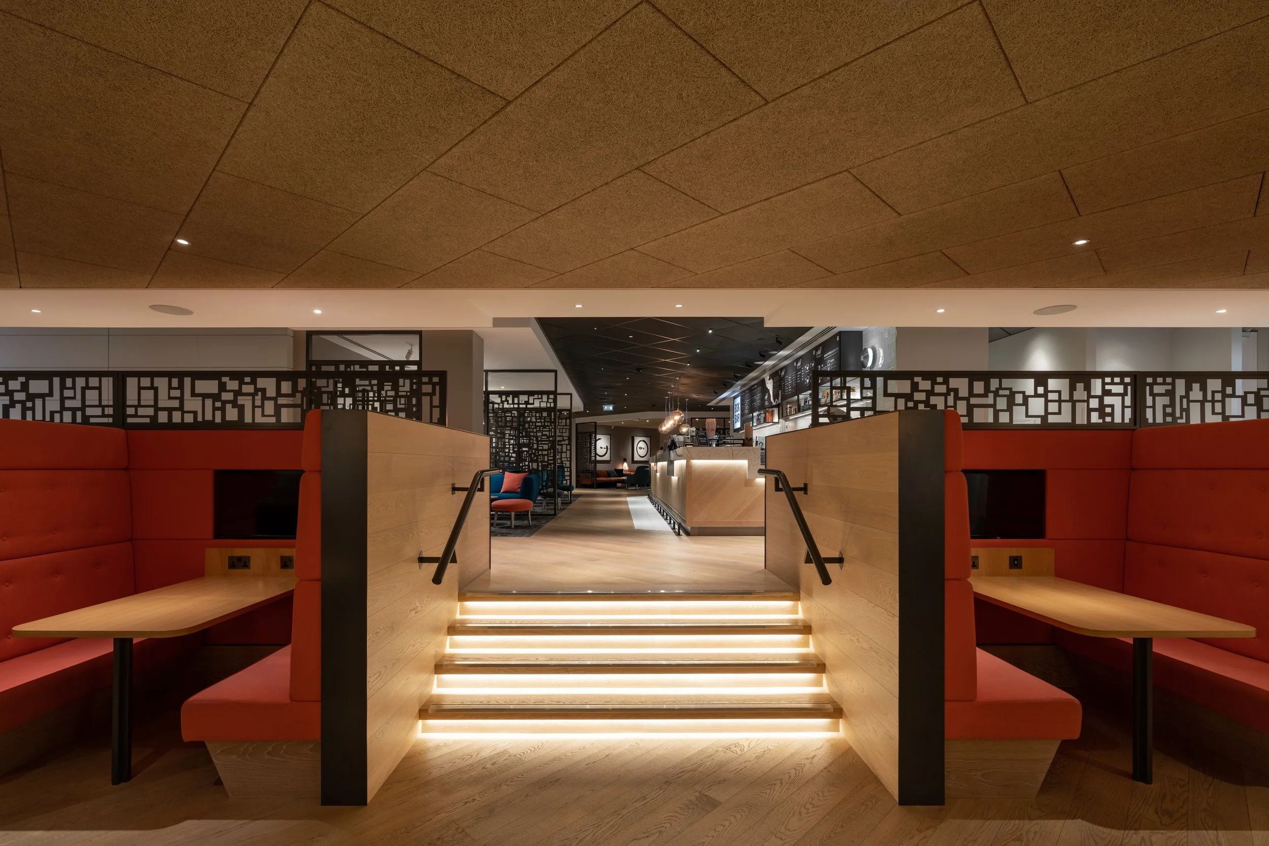 An image of lit stairs leading to bar area