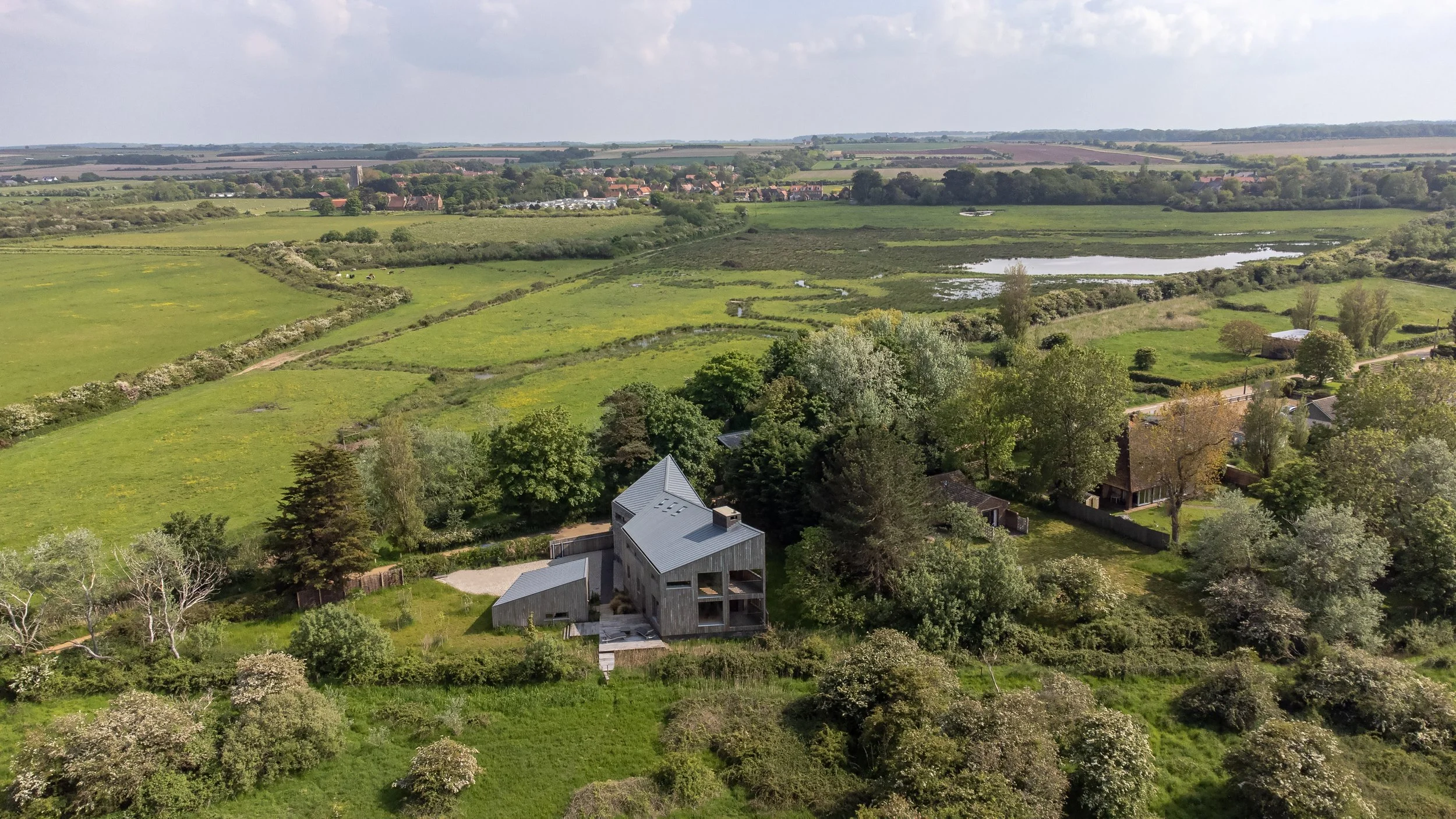 An image of a Marsh Edge House in the countryside