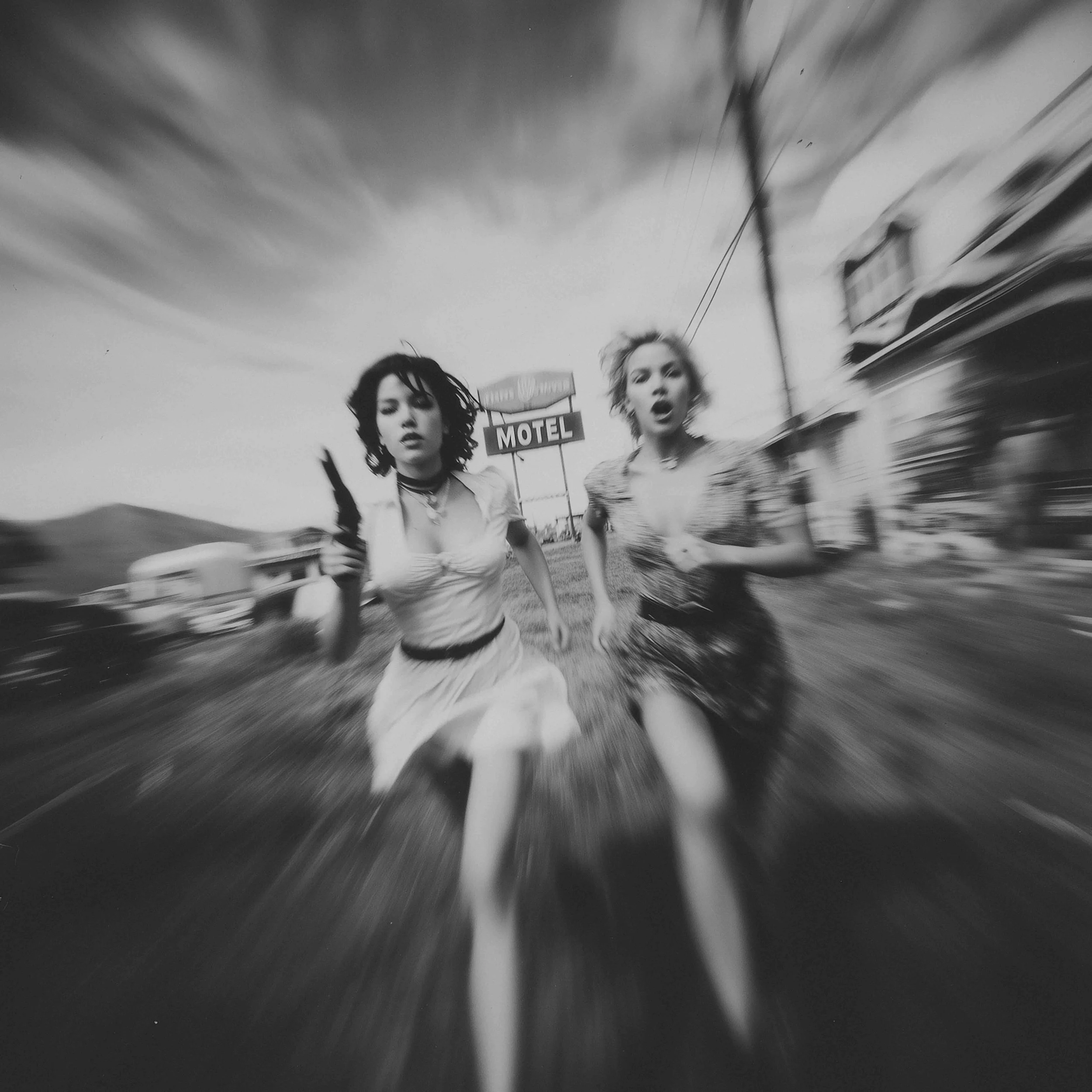 davidgalstyan_black-and-white_photograph_of_two_women_running_o_05d7cd3c-a788-4692-a19a-b8dfd23d905a.jpg