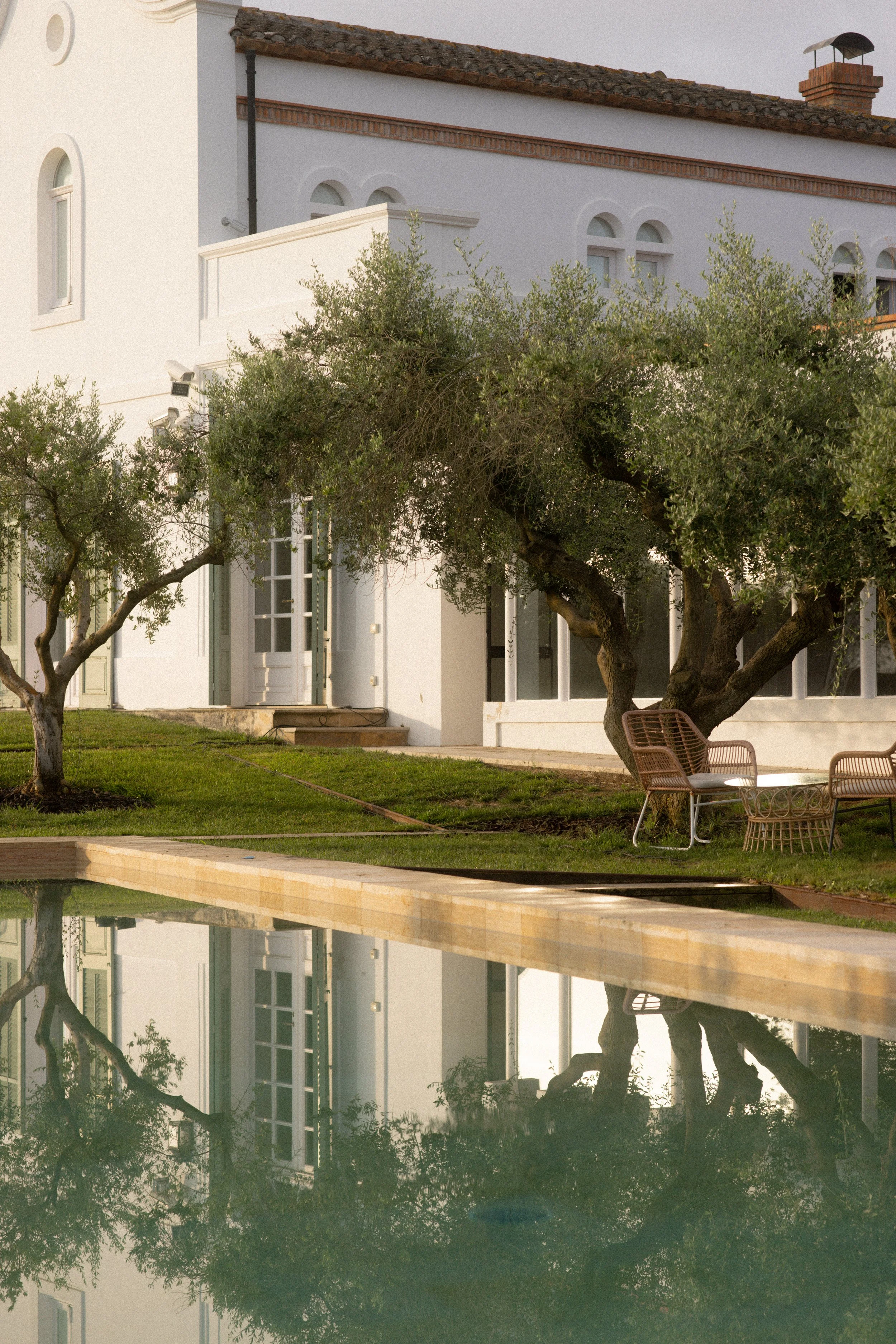 Modern Mediterranean architecture and pool reflection at Font de la Canya guest villa and gardens.