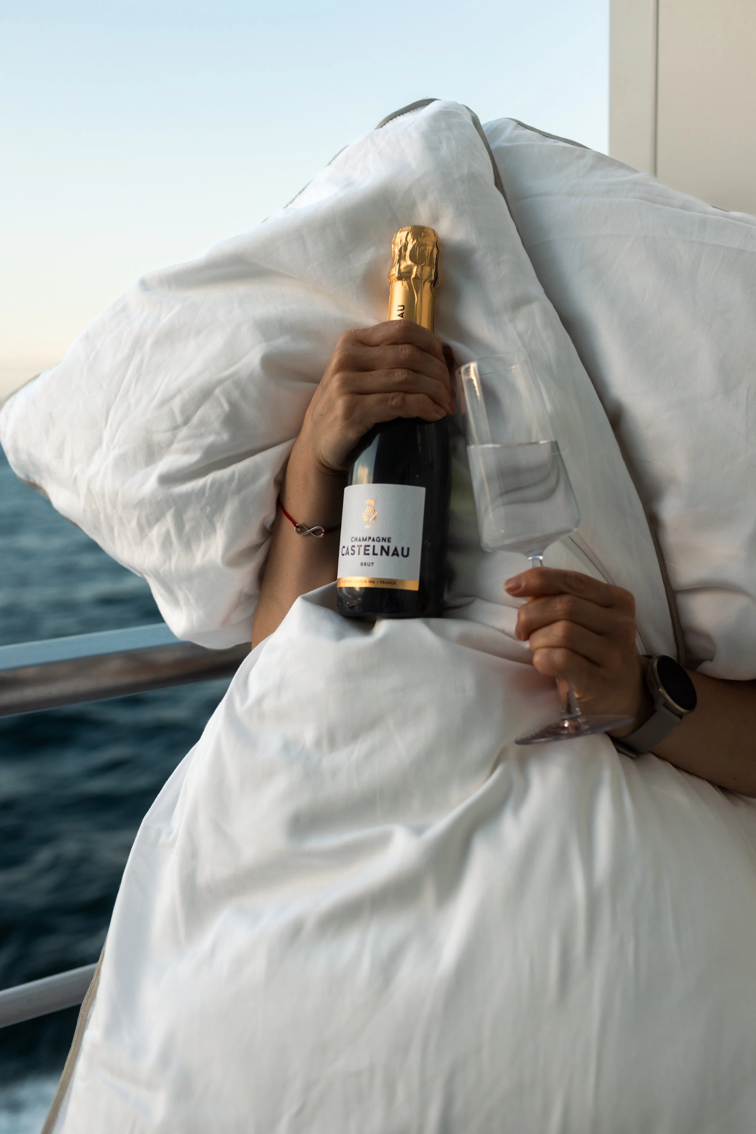 Luxury travel lifestyle photography with Champagne and tactile details aboard an expedition cruise
