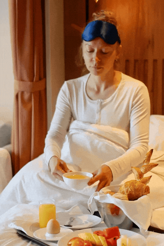 Swan Hellenic SH Minerva expedition cruise photography, guest having breakfast in bed with a sleep mask.
