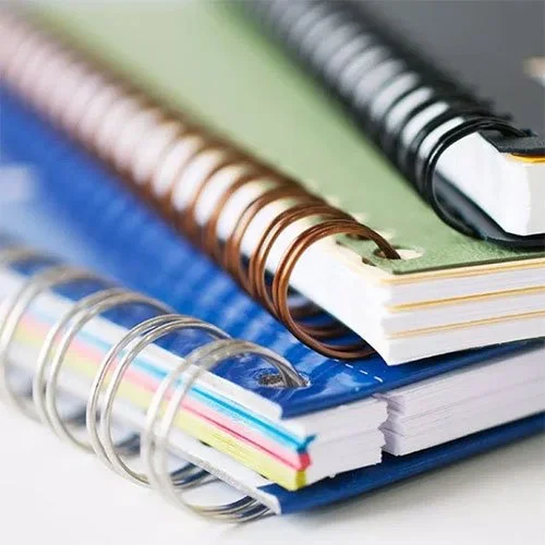 stack of spiral bound notebooks