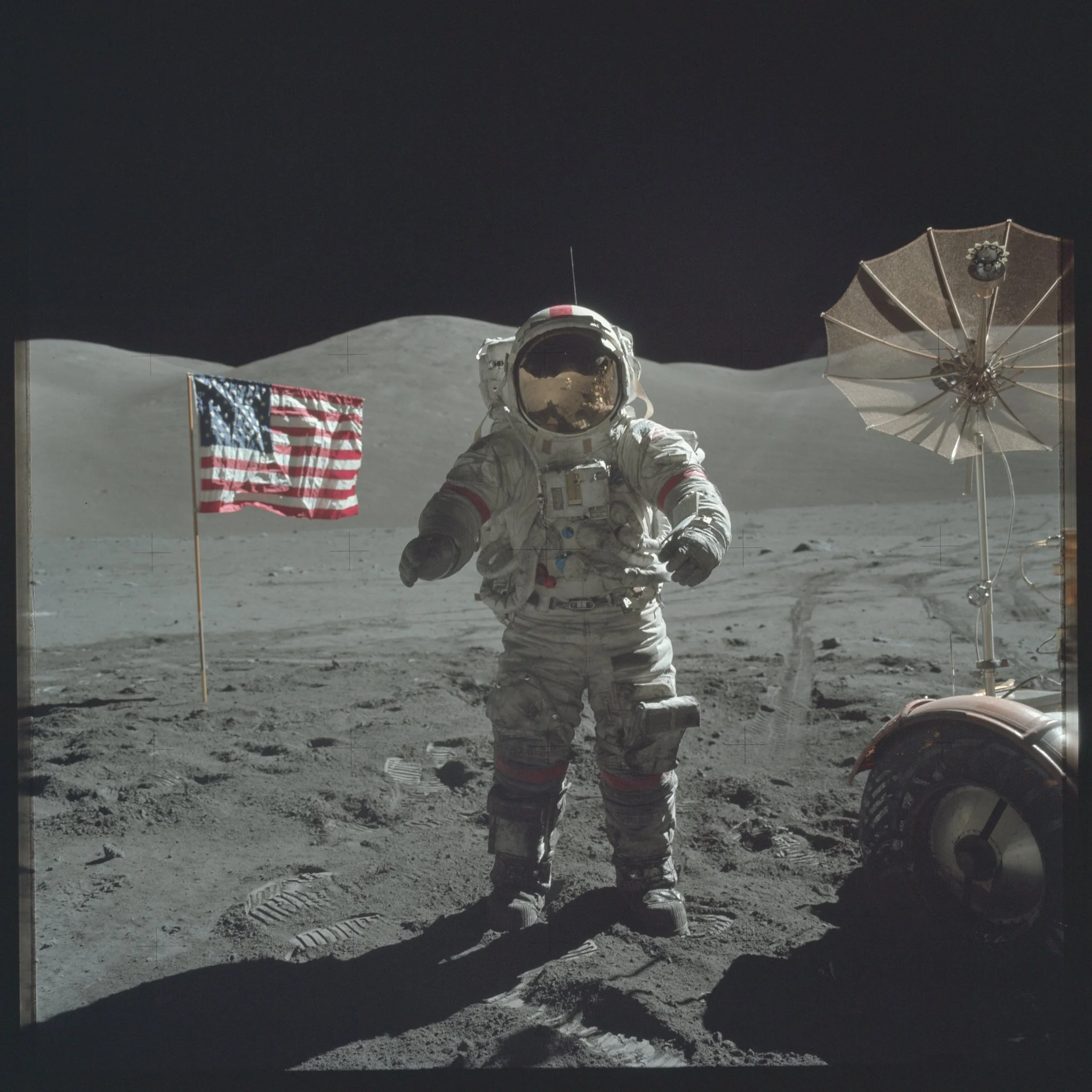astronaut and flag on the moon