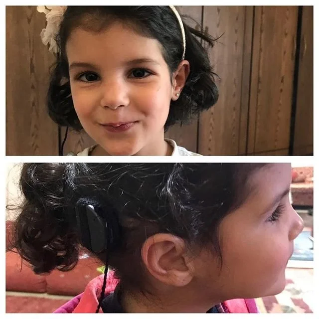 Close-up of a young girl with dark curly hair and a headband, smiling at the camera. Inside the second photo, her side profile shows her wearing a headset. Wooden wall in the background.