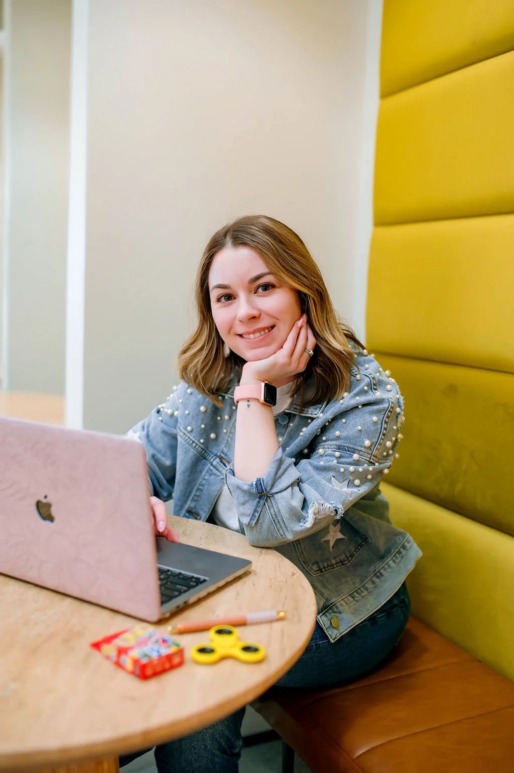 A young woman in Caddo Frisco office lobby, who does therapy for young adults and teens.