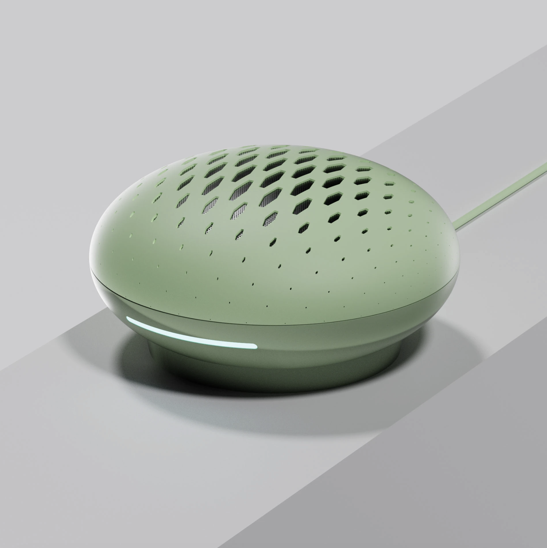 A futuristic mint green smart speaker with a rounded shape, perforated top, and a light strip near the base, connected by a thin wire.