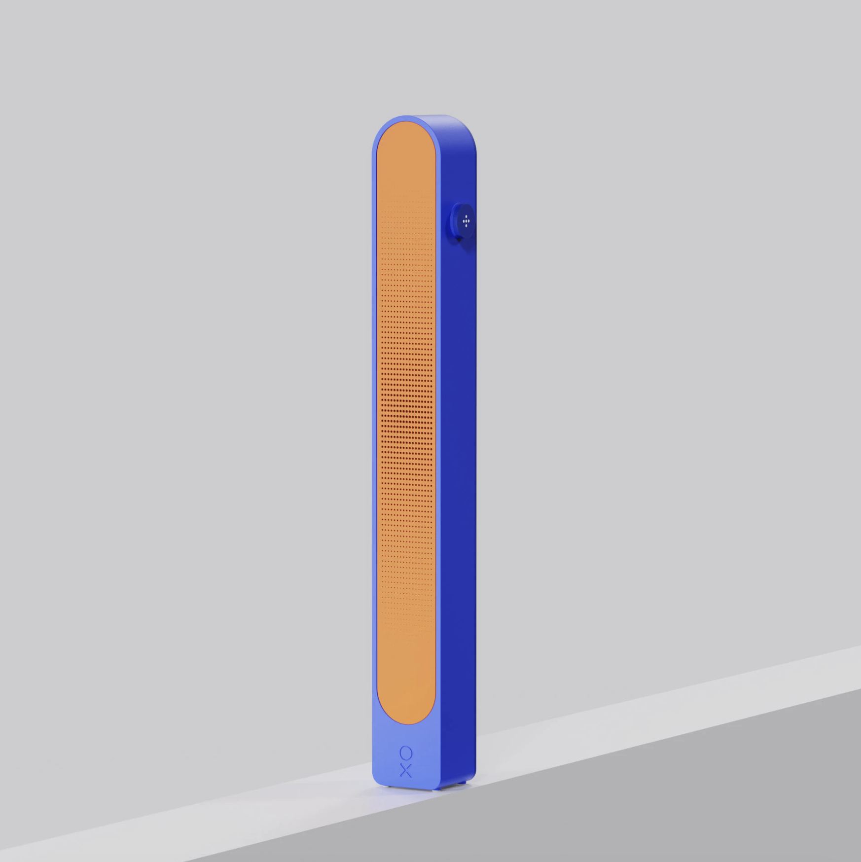 A tall, rectangular electronic device with a blue body and an orange front panel. The device has a small round knob on its side and the letters 'OX' on the bottom front.