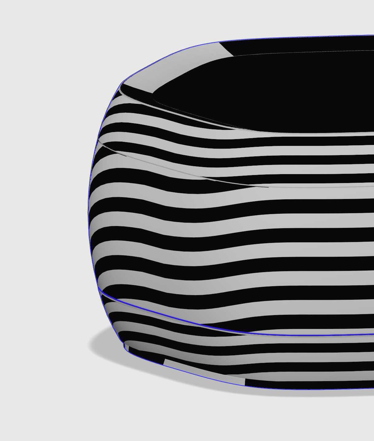 Close-up of a black and white modern striped ceramic vase on a light background.