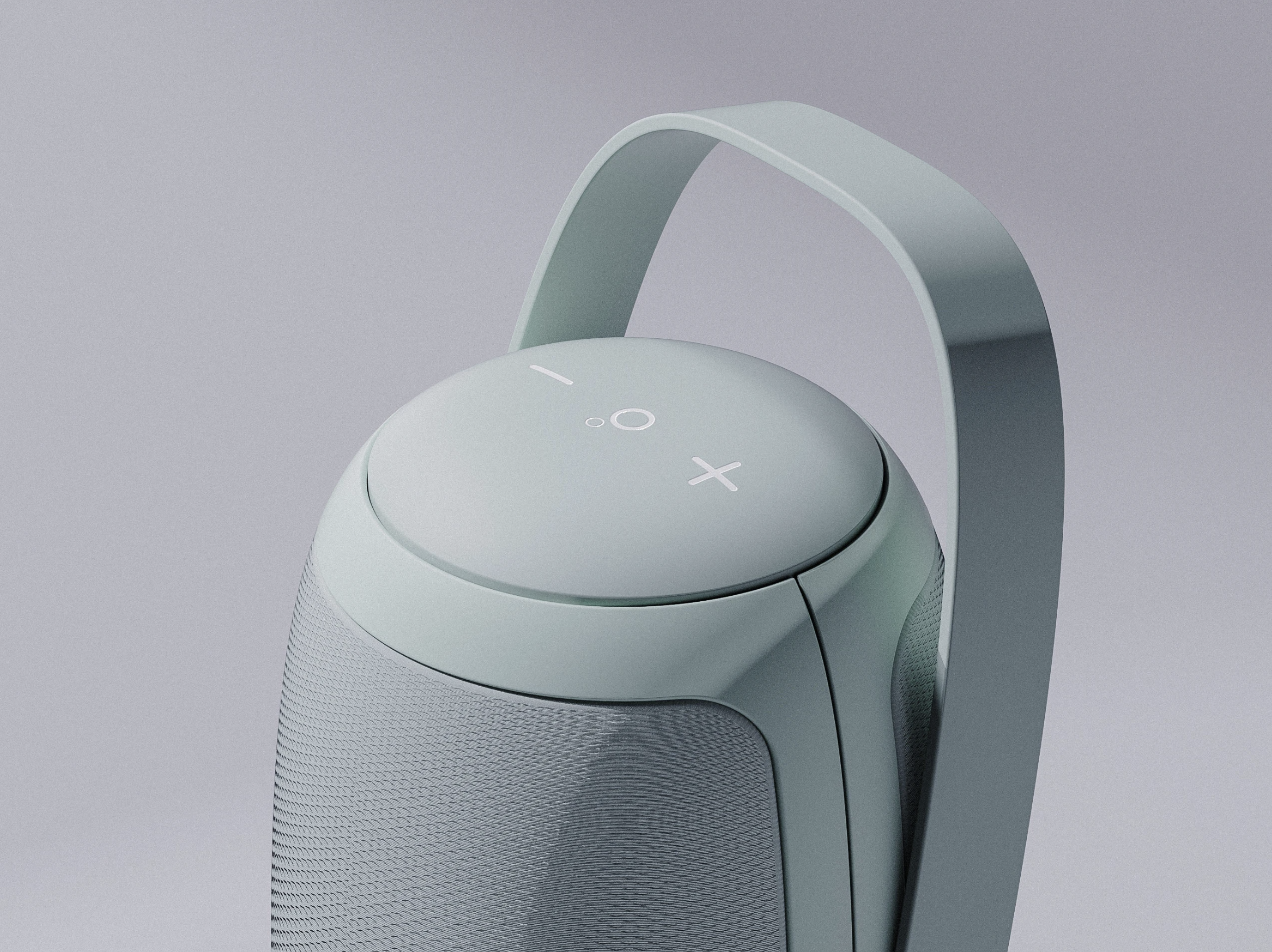 A modern grey portable Bluetooth speaker with a cylindrical shape, a handle on top, and control buttons on the top surface.