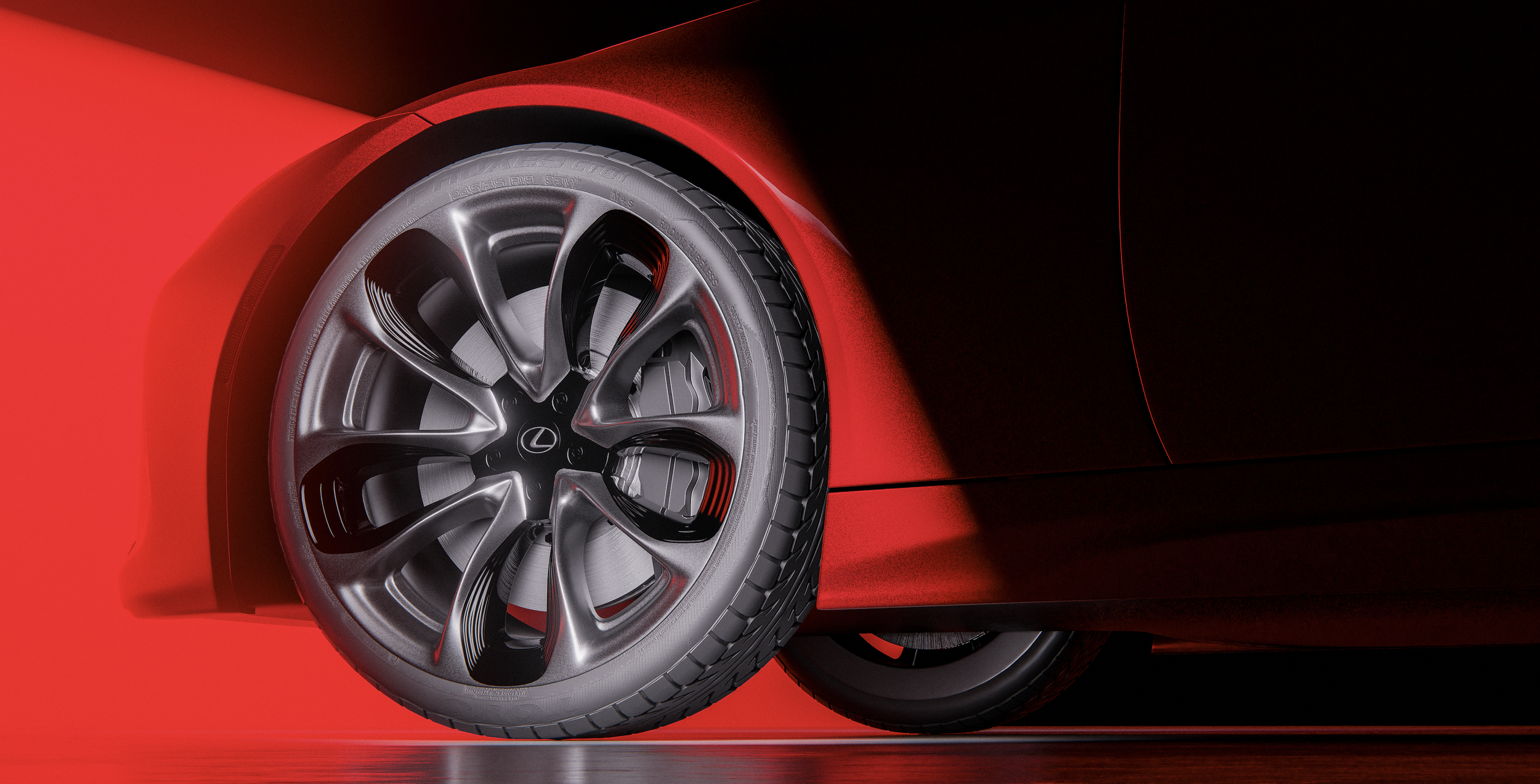 Close-up of a futuristic red car, showing a detailed view of the front wheel and part of the sleek body.