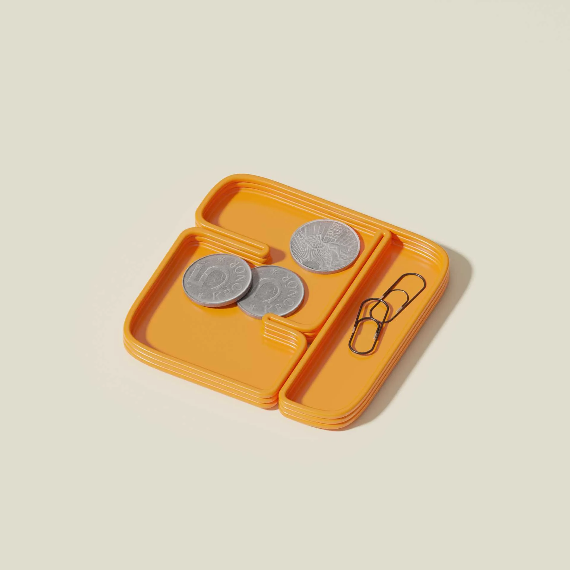 Orange coin organizer with three coins inside and two paper clips on the side