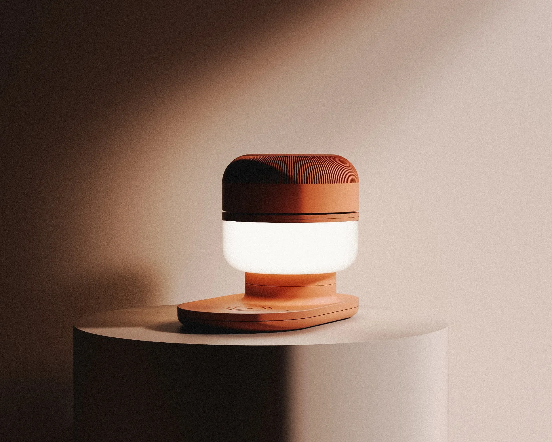 A modern, round, portable speaker with a brown top and a white lower section, sitting on a white cylindrical pedestal against a plain beige background.