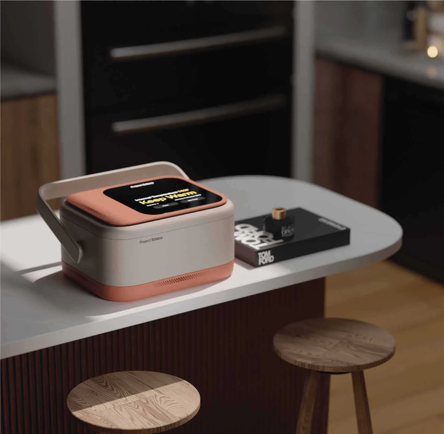 A small, beige and pink Project Solace device on a white table, displaying a message on its screen that says "Keep Warm." Next to it are a black notebook, a small bottle, and a wooden stool.