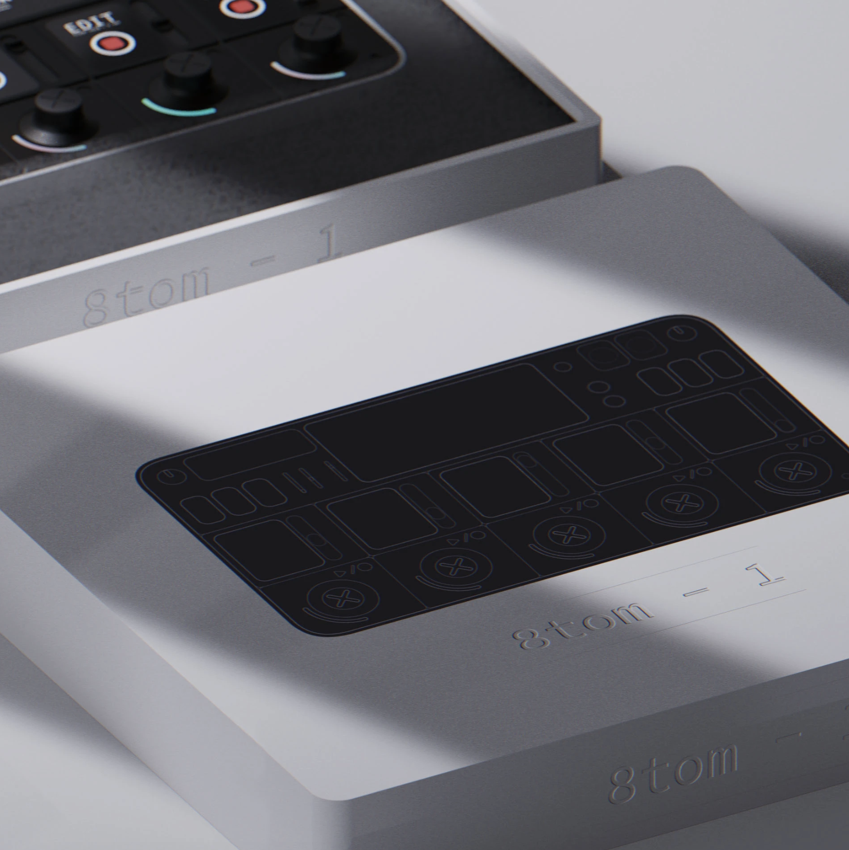 Close-up of a sleek, modern remote control with a black outline on a white surface, with an out-of-focus electronic device in the background.