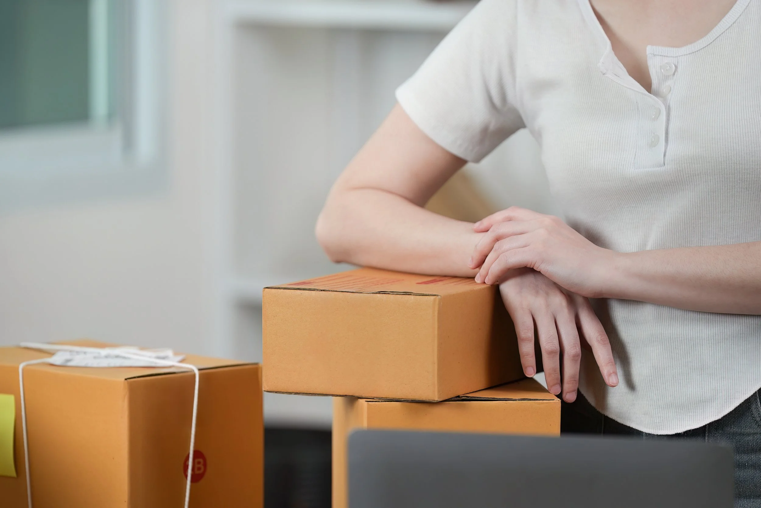 The Eyelash Design Company member preparing order parcels