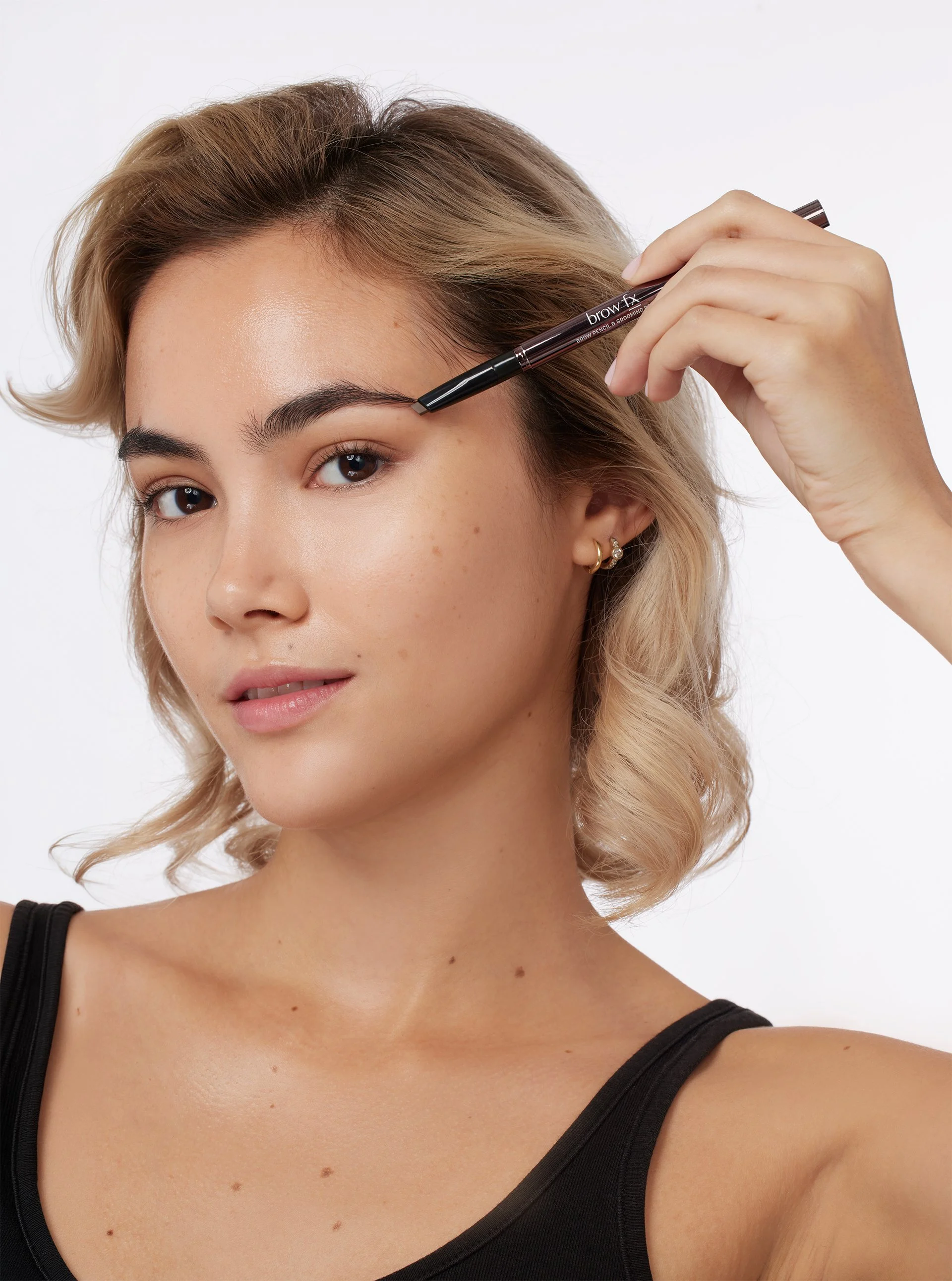 Model using a Brow FX Brow Pencil
