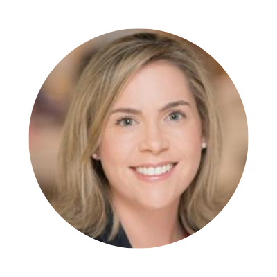 A smiling woman with shoulder-length blonde hair and blue eyes.