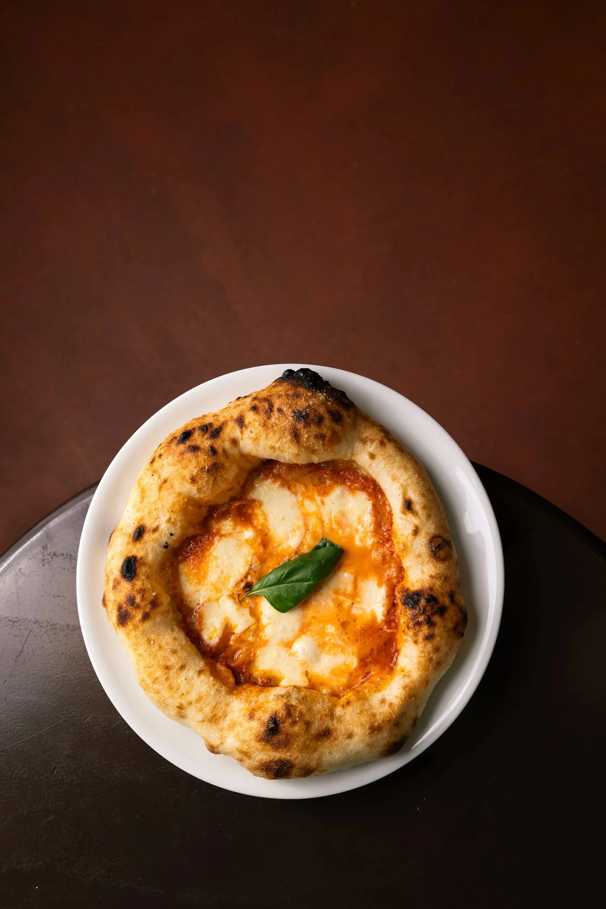 Styled food dish photographed for a restaurant menu, pizza and pasta restaurant food photography, Julian Juarez food photographer