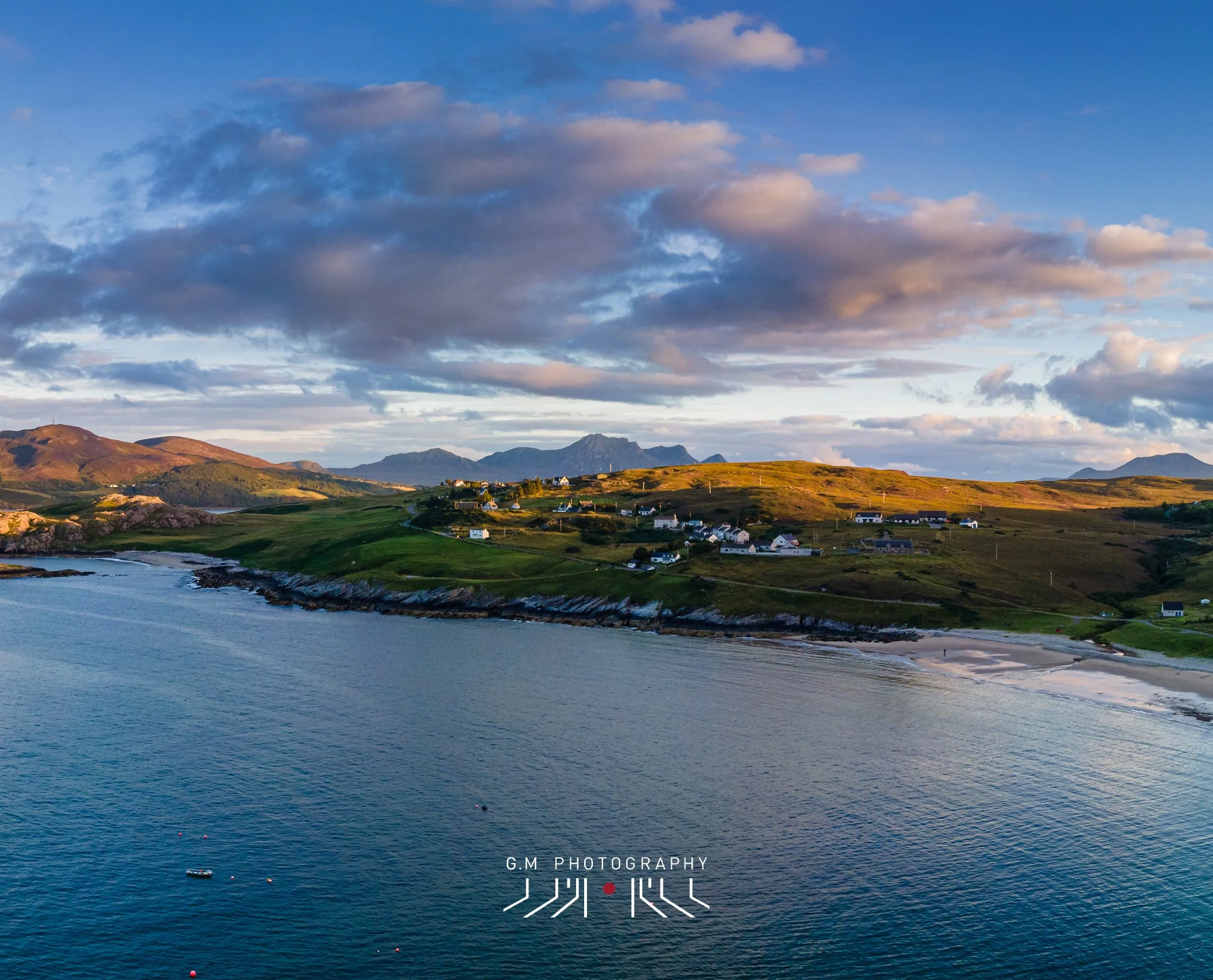 Picture taken by local photographer Gary Macleod - A scenic view looking across Talmine towards Ben Loyal under a partly cloudy sky during sunset.