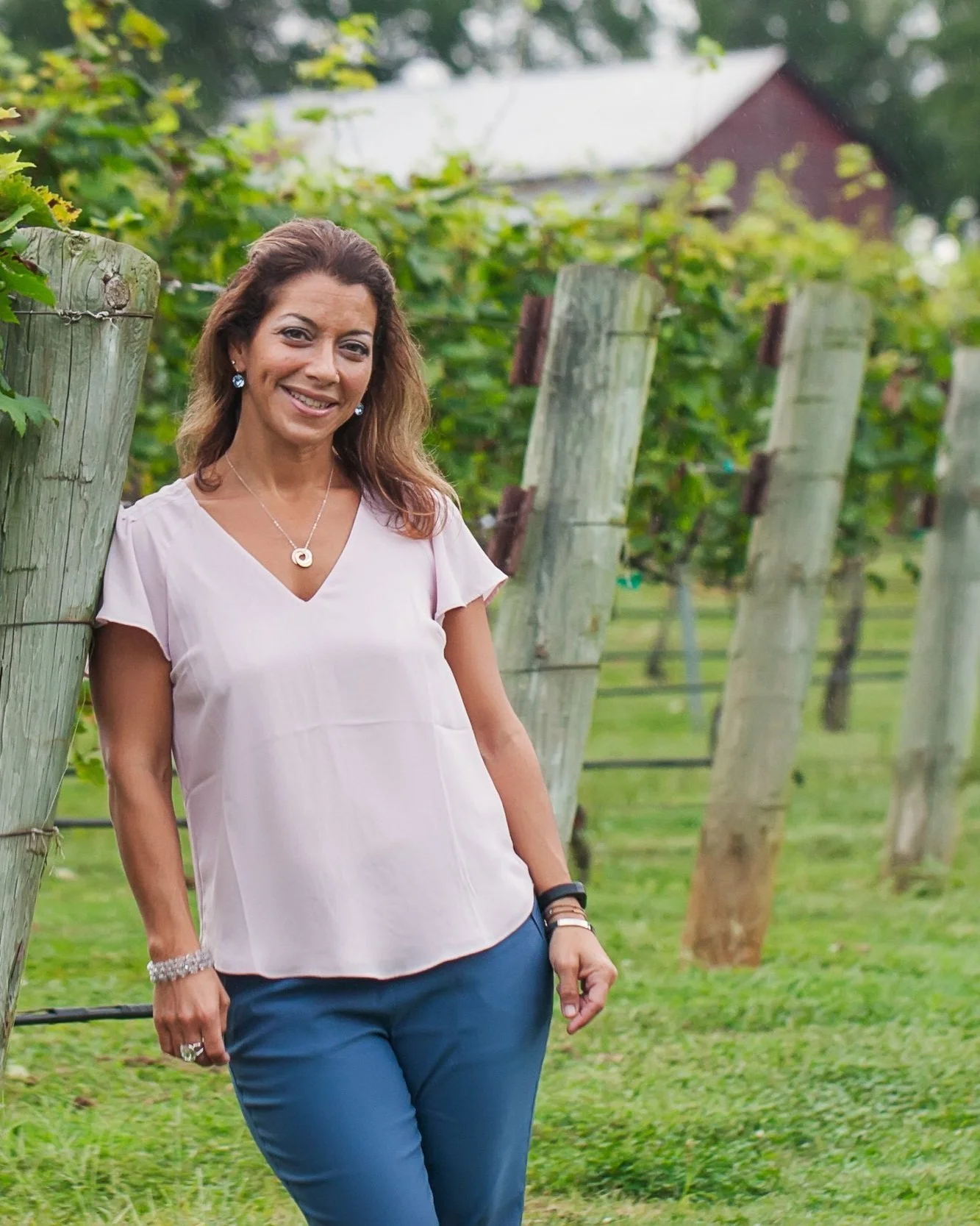 Professional life coach and massage therapist Deanna Scaldaferri at a vineyard. Healing Hands by Deanna LLC provides holistic wellness and recovery coaching in Charlotte NC.