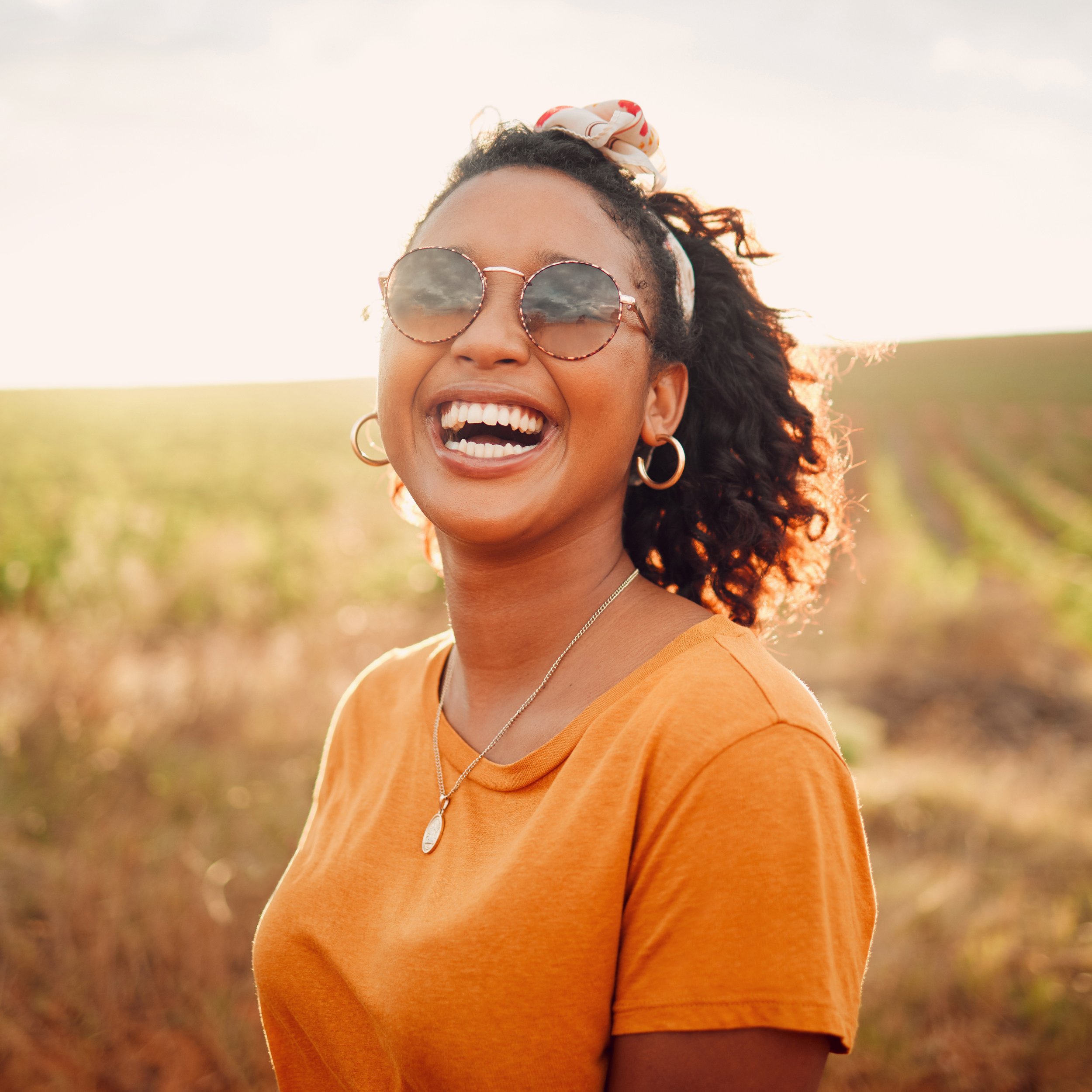 Young adult celebrating emotional healing and confidence after narcissistic abuse recovery. This image represents the clarity gained through the guide - How to Spot a Narcissist - by Healing Hands by Deanna LLC.