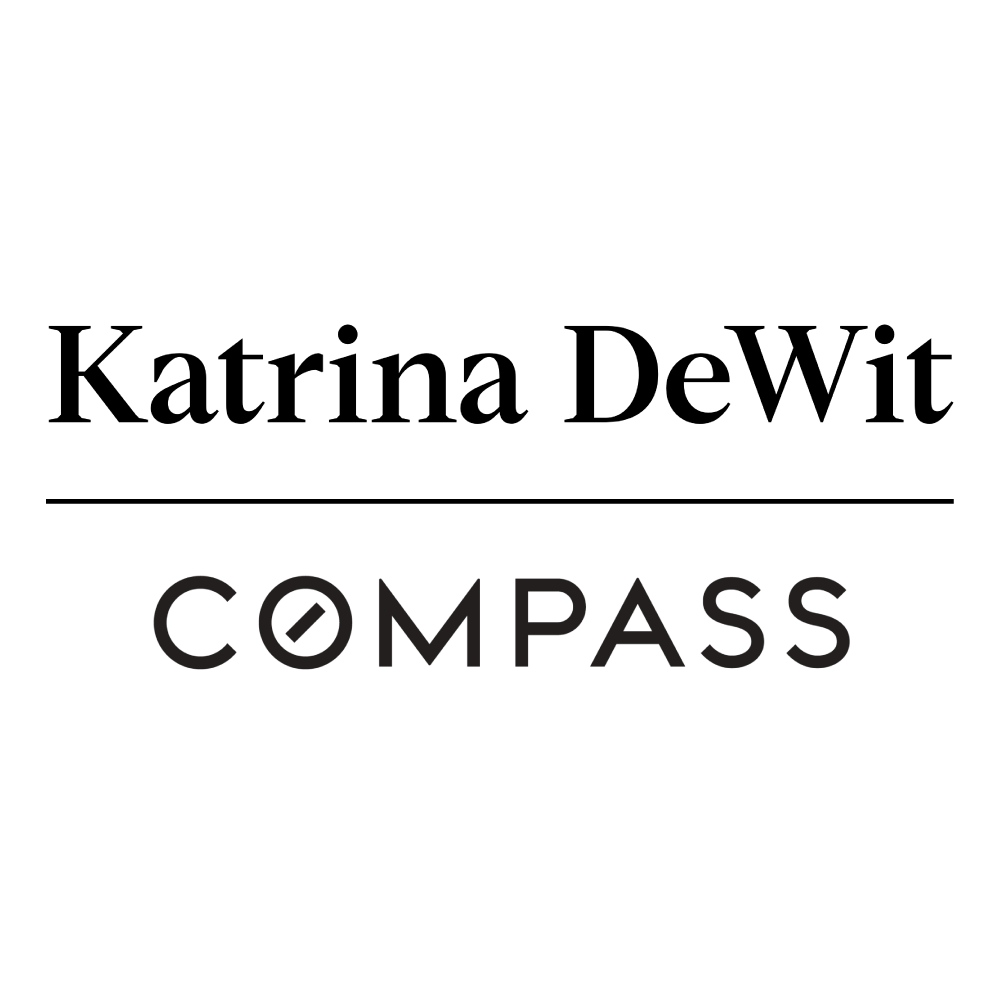Black and white logo with a stylized mountain and compass icon, and the word 'COMPASS' beneath.